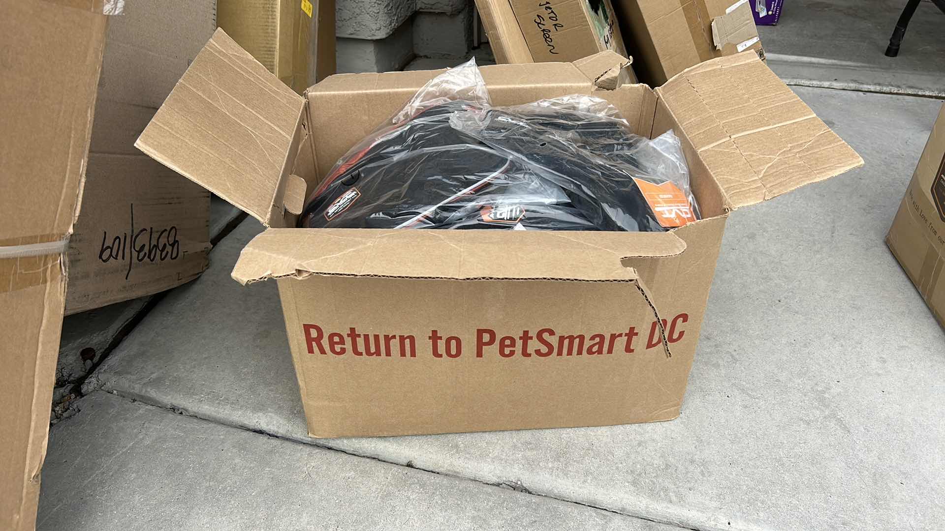 Photo 1 of LARGE BOX FULL OF NEW DOG HARNESSES AND SADDLEBAGS 