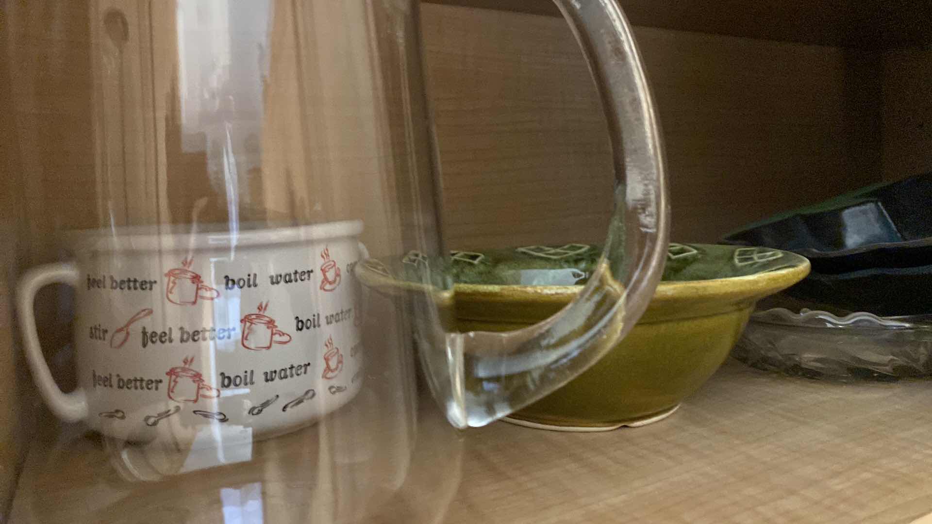 Photo 1 of CONTENTS OF KITCHEN CABINET MIXING BOWLS MEASURING CUPS BASKETS