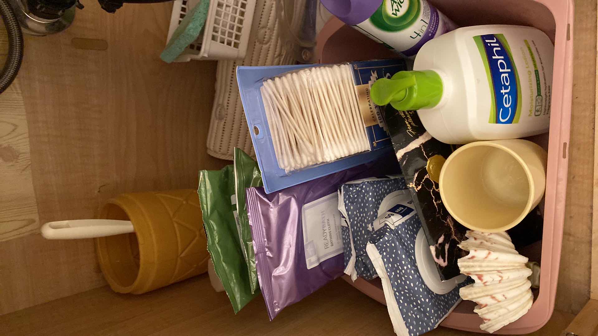 Photo 2 of CONTENTS UNDER HALL BATH SINK, RUG HAND TOWELS TRASH CAN