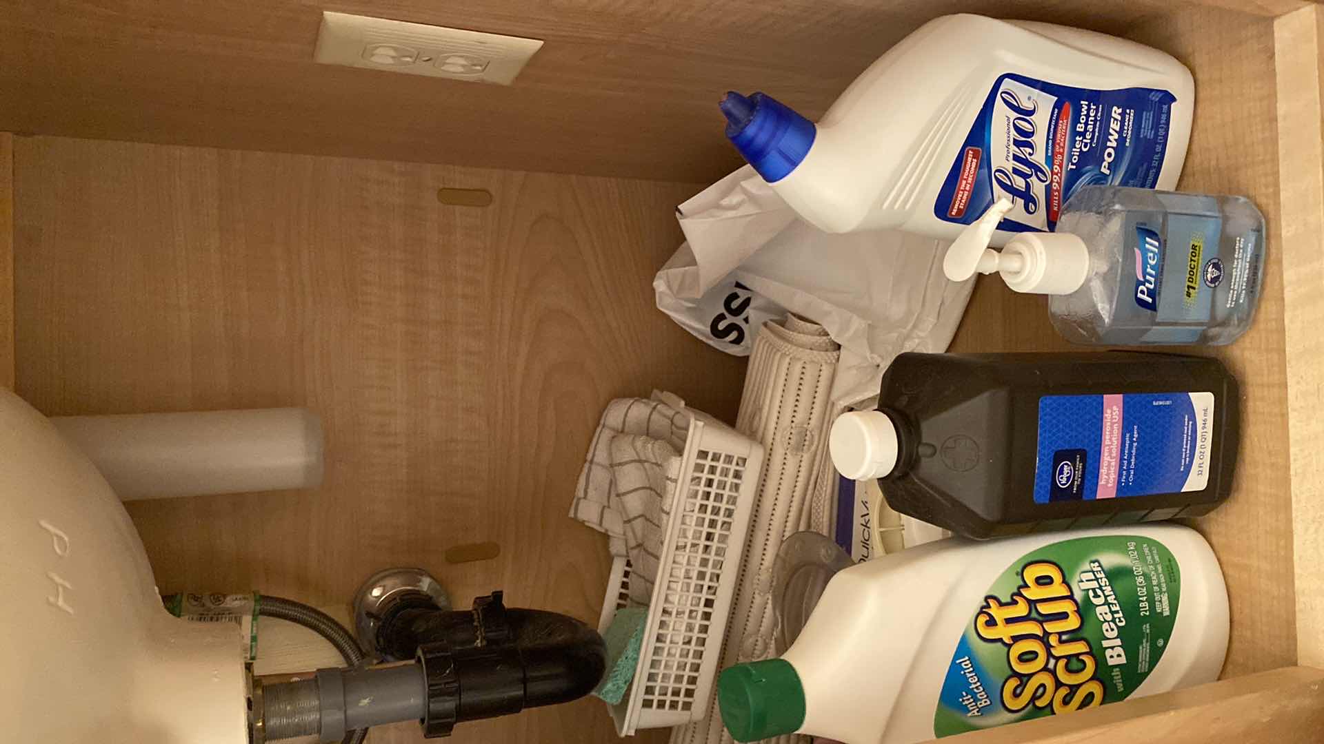 Photo 3 of CONTENTS UNDER HALL BATH SINK, RUG HAND TOWELS TRASH CAN