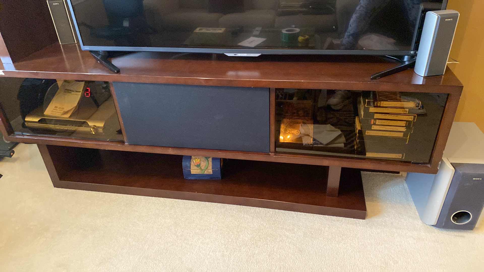 Photo 1 of ENTERTAINMENT CENTER 78“ x 19“ H80” LAMINATE PEELING AND CHIPPED, CONTENTS NOT INCLUDED