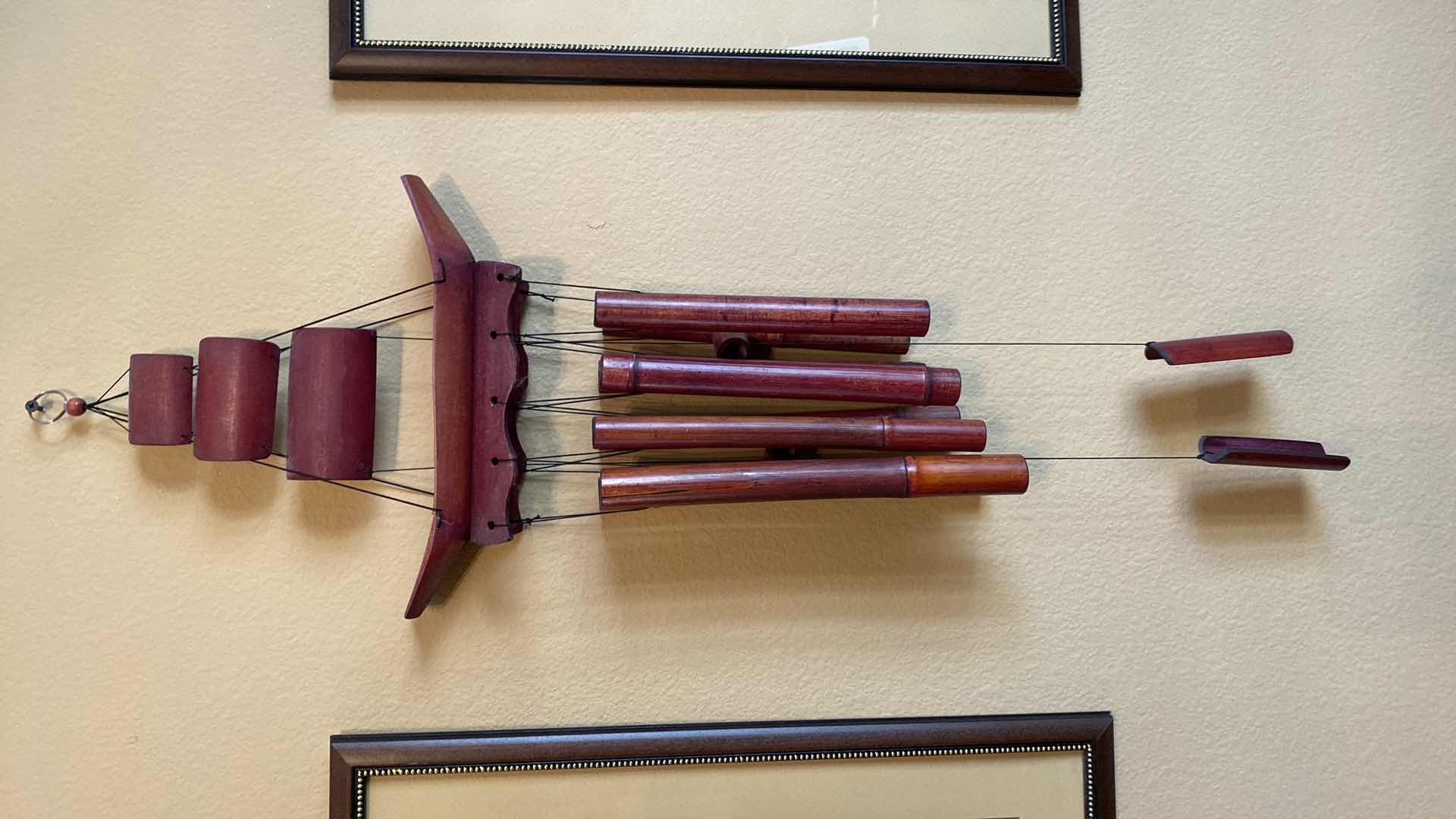 Photo 1 of PAIR OF TROPICAL ARTWORK 17 1/2” x 21 1/2” AND WOOD WIND CHIME