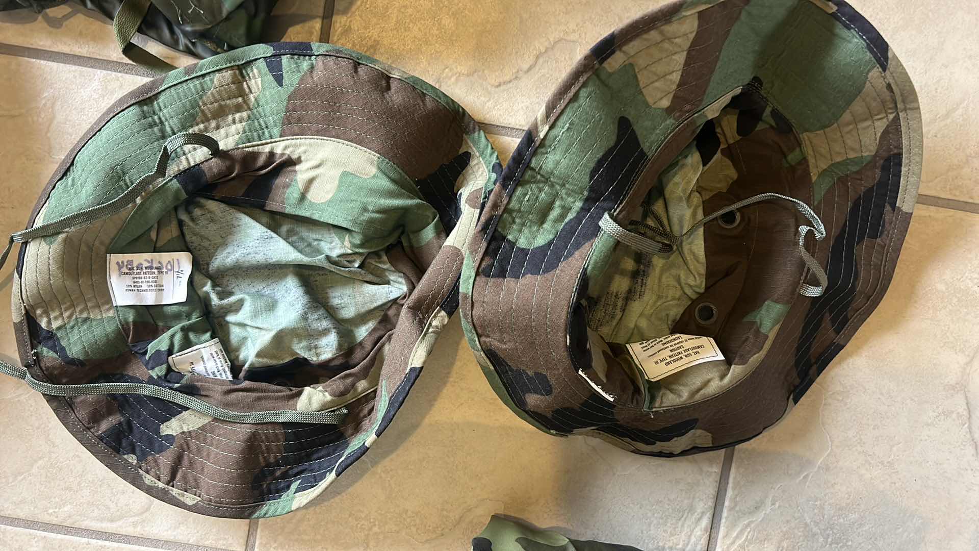 Photo 1 of MILITARY CAMO GEAR 1 JACKET, 3 PANTS AND 2 HATS