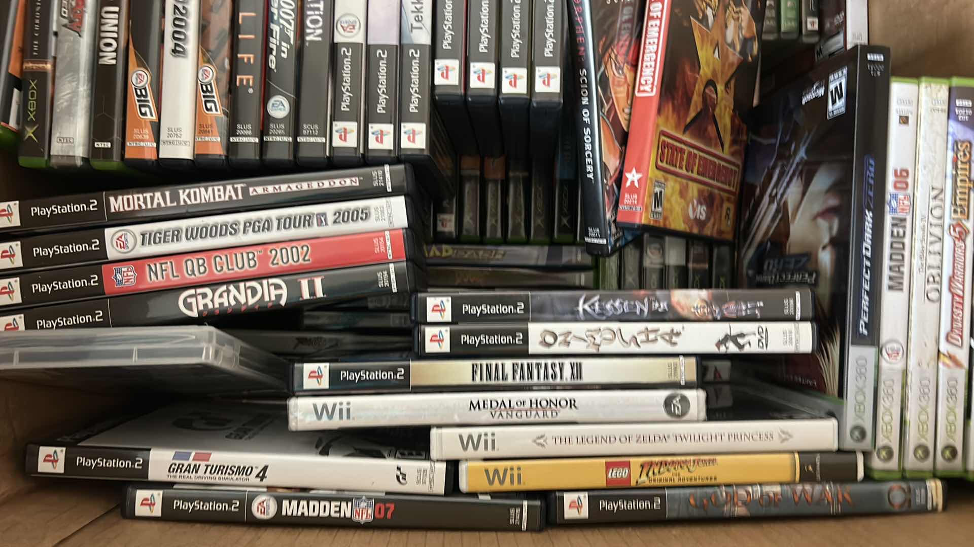 Photo 1 of LARGE BOX FILLED WITH XBOX AND PLAY STATION GAMES