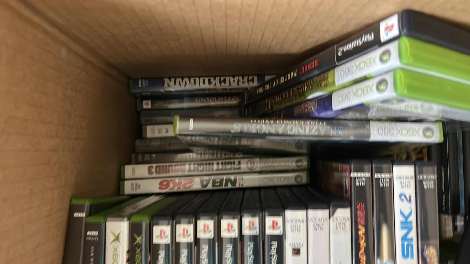 Photo 1 of LARGE BOX FILLED WITH XBOX AND PLAY STATION GAMES