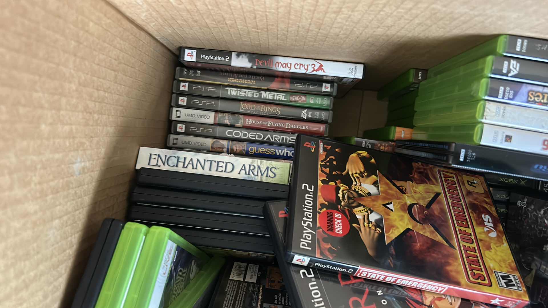 Photo 1 of LARGE BOX FILLED WITH XBOX AND PLAY STATION GAMES