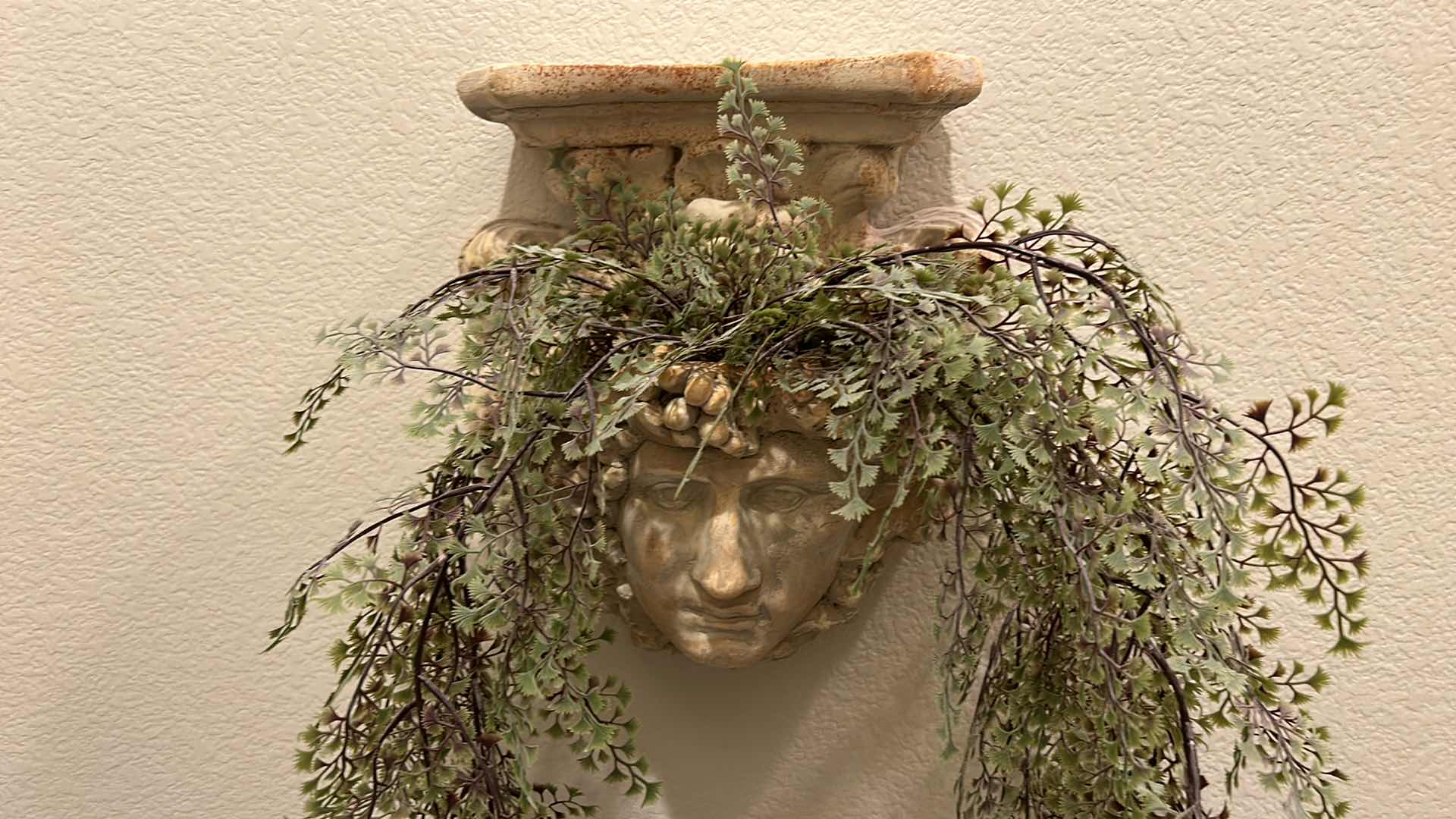 Photo 1 of HEAVY CERAMIC WALL DECOR WITH FAUX GREENERY 12” x 13”