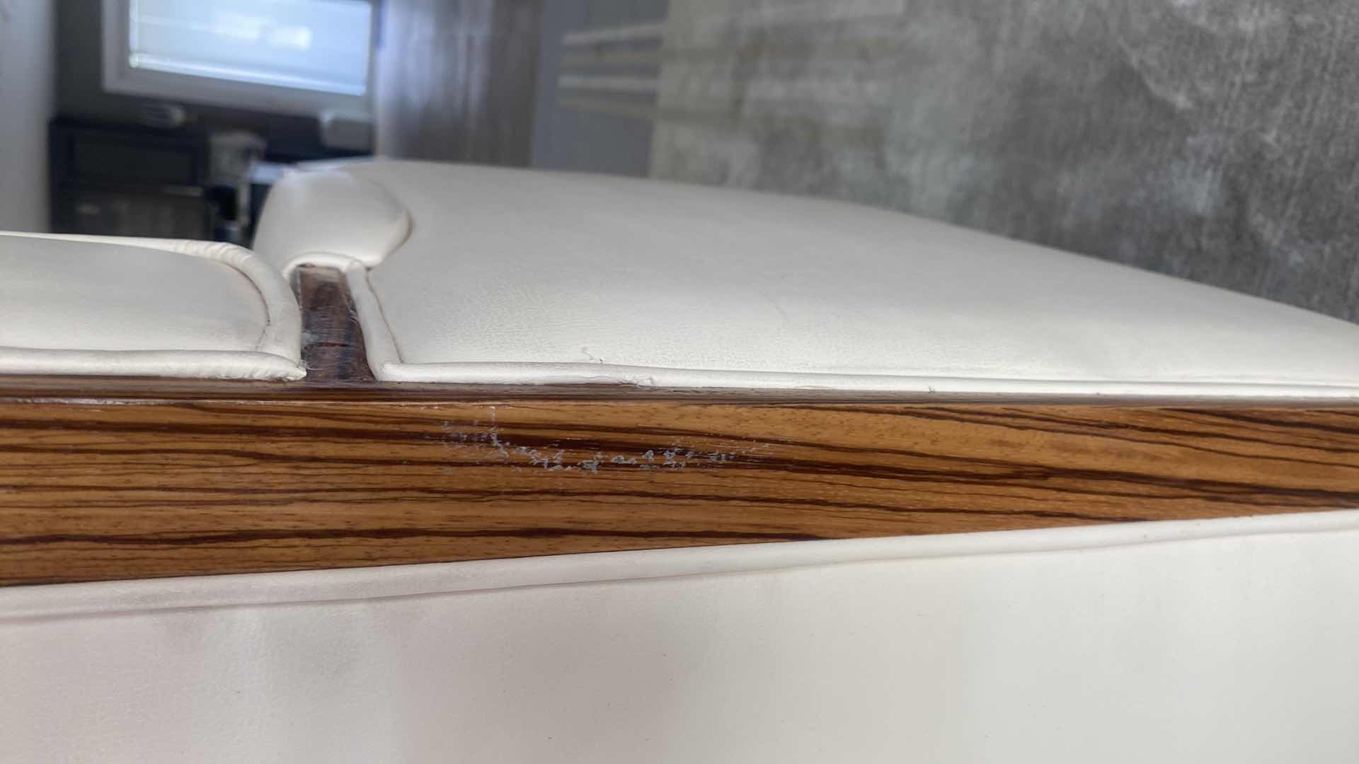 Photo 1 of CREAM BONDED LEATHER 2 PIECE SECTIONAL WITH WOOD TRIM 8’10” x 7’ 11” H36 1/2”