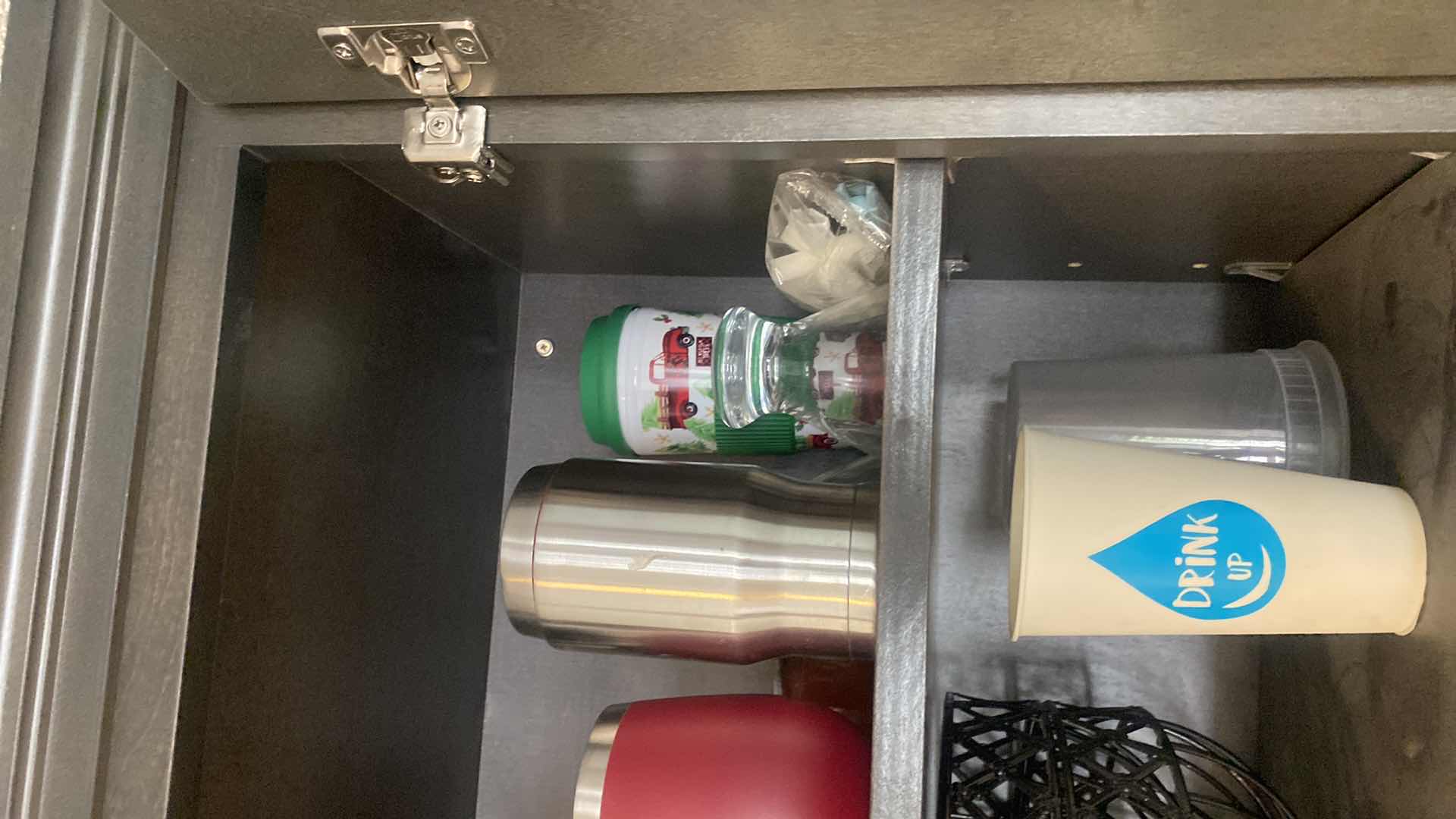 Photo 1 of CONTENTS KITCHEN CABINET-2 SHELVES BOWLS, 2 BLACK FRUIT BASKETS, TRAVEL CUPS
