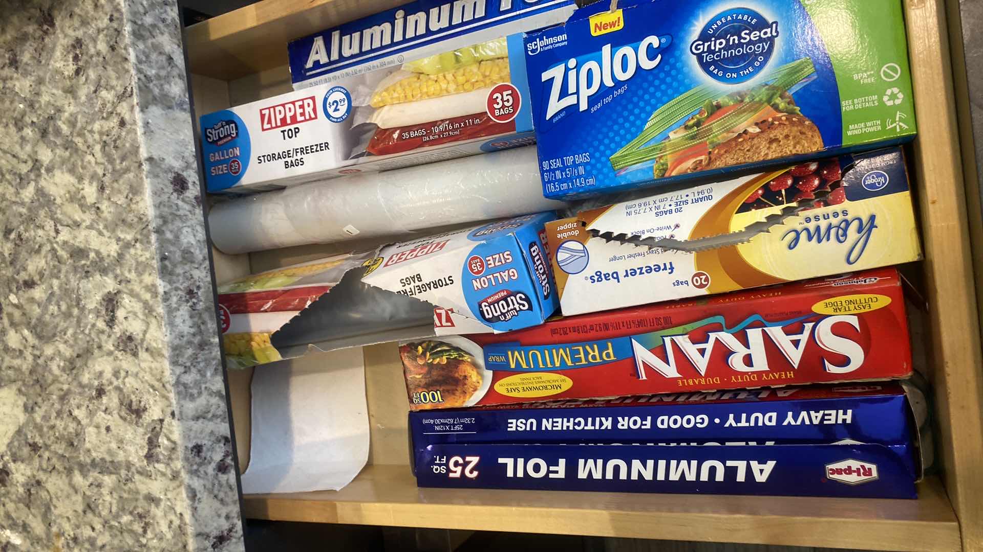 Photo 1 of CONTENTS KITCHEN CABINET-2 DRAWERS PLASTIC SILVERWARE & STORAGE BAGS & WRAPS