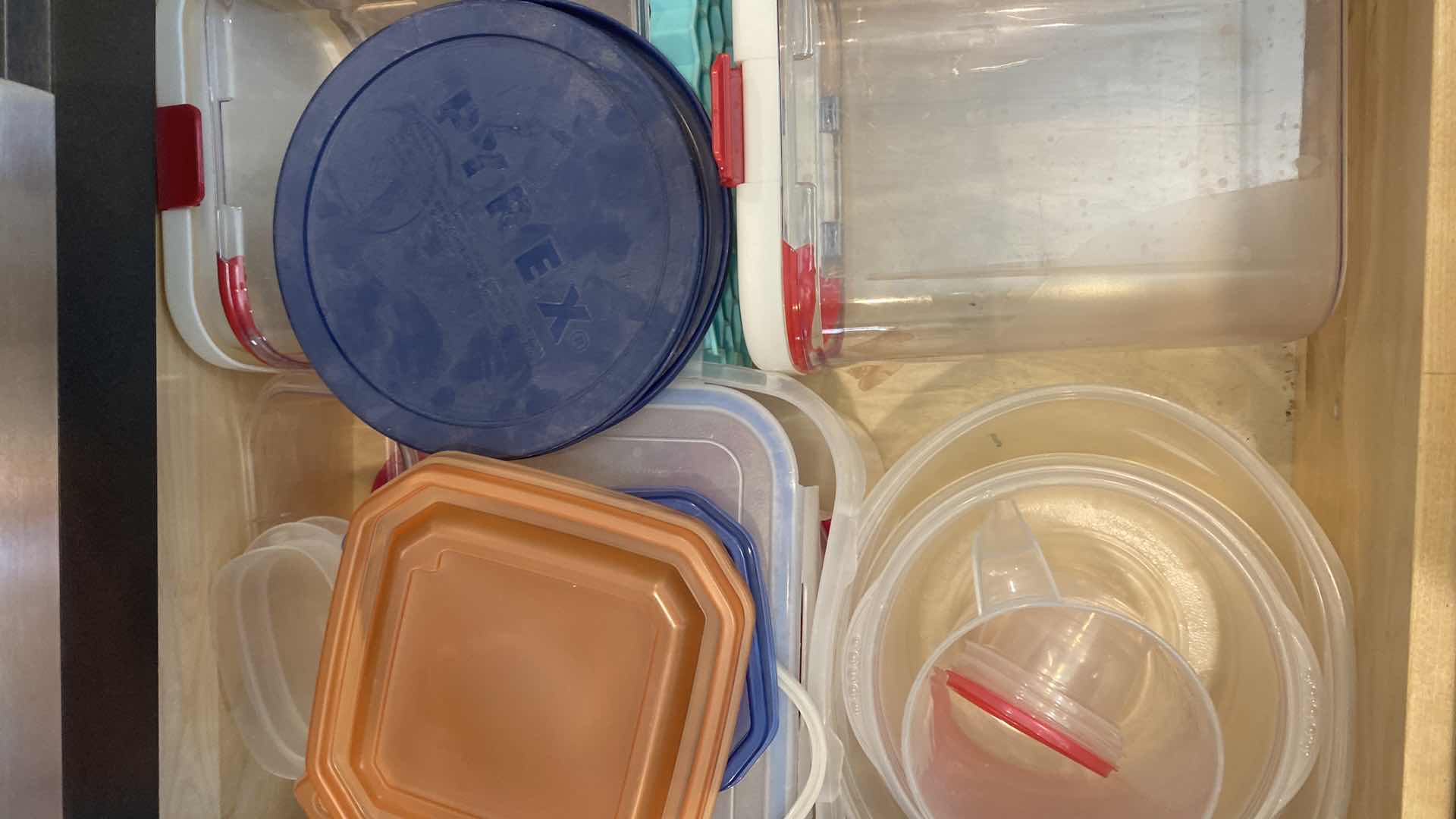 Photo 1 of CONTENTS KITCHEN CABINET-DRAWER WITH PLASTIC STORAGE AND LIDS