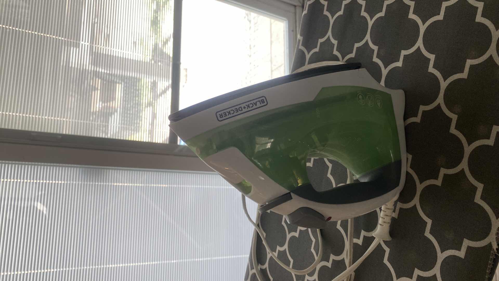 Photo 1 of IRONING BOARD AND BLACK &DECKER IRON