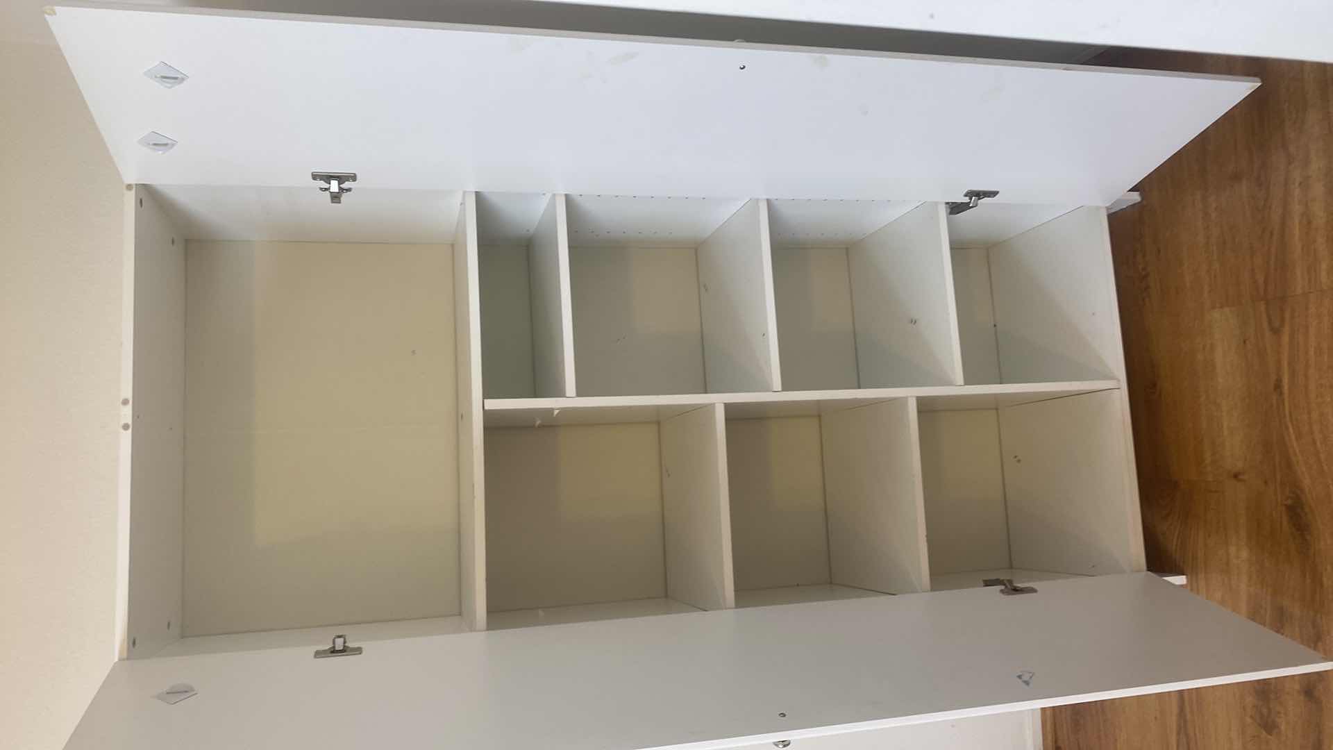 Photo 1 of WHITE TWO DOOR PRESSBOARD CABINET 30” x 15 1/2” H 72”