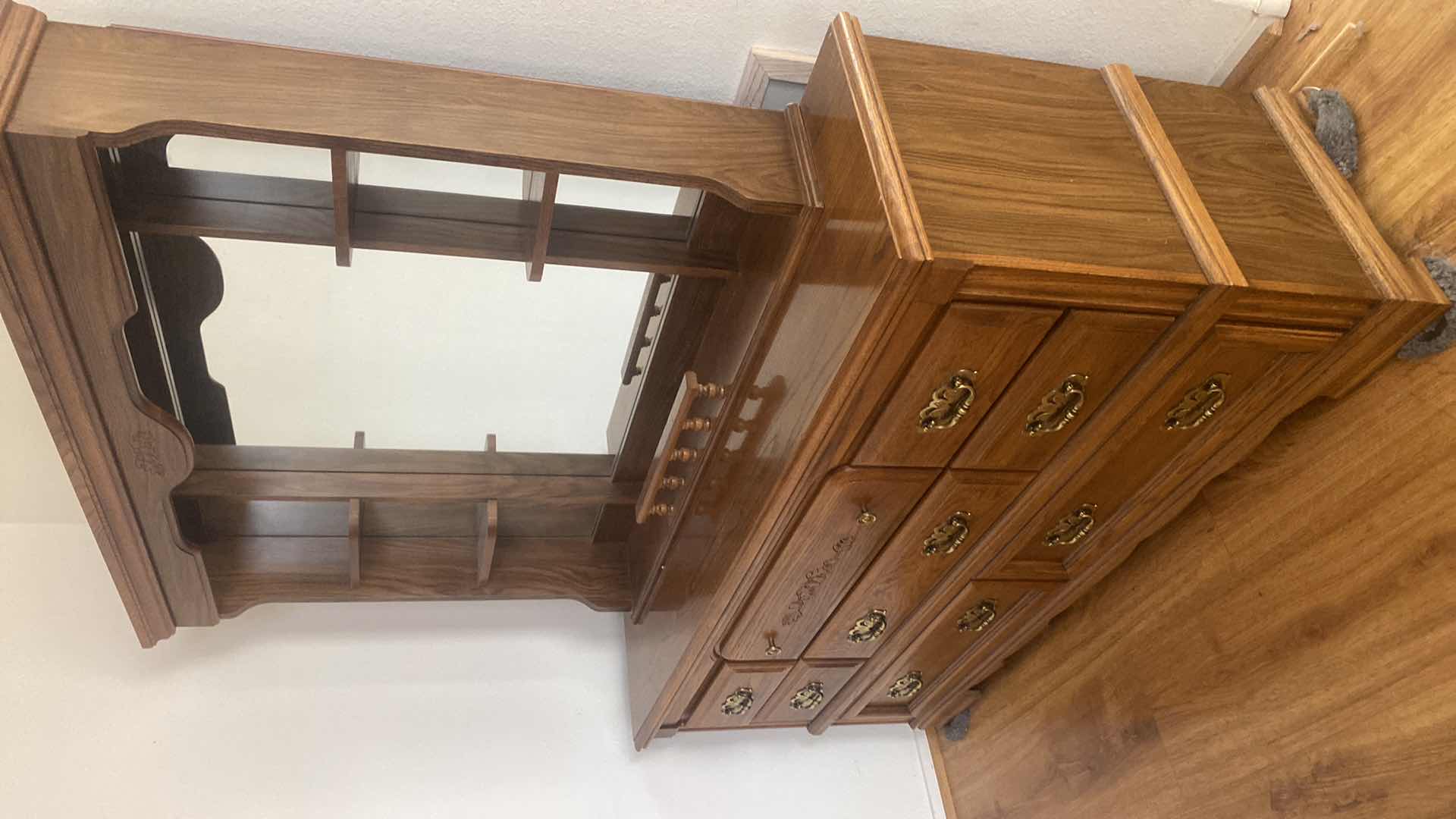 Photo 1 of BROYHILL OAK WOOD 8 DRAWER DRESSER WITH MIRROR DRESSER MEASURES 66“ x 17 1/2“ H32 1/2“
MIRROR 53 1/2“ x 8 1/2“ H41”