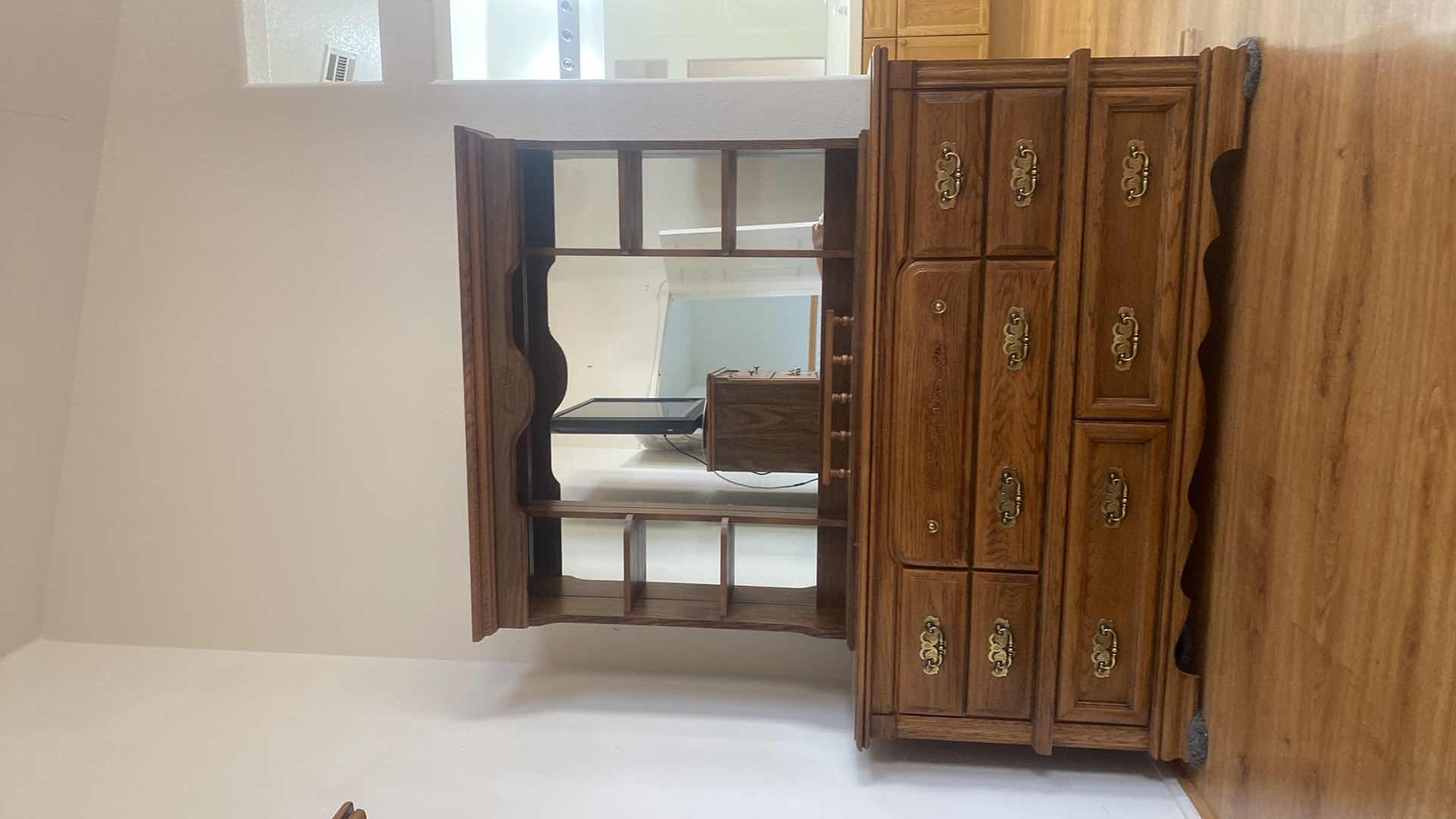 Photo 1 of BROYHILL OAK WOOD 8 DRAWER DRESSER WITH MIRROR DRESSER MEASURES 66“ x 17 1/2“ H32 1/2“
MIRROR 53 1/2“ x 8 1/2“ H41”