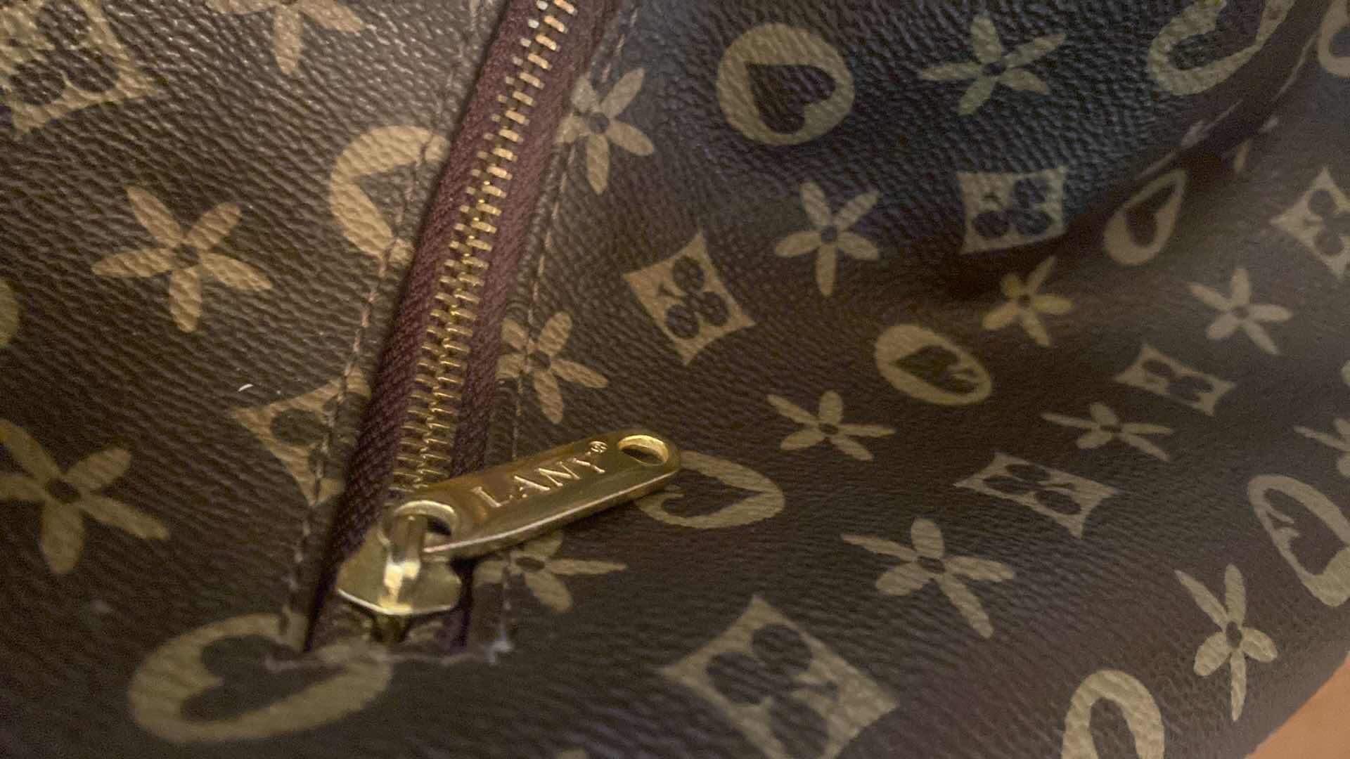 Photo 1 of LANY HANDBAG - HANDLE REQUIRES REPAIR 14” x 12”