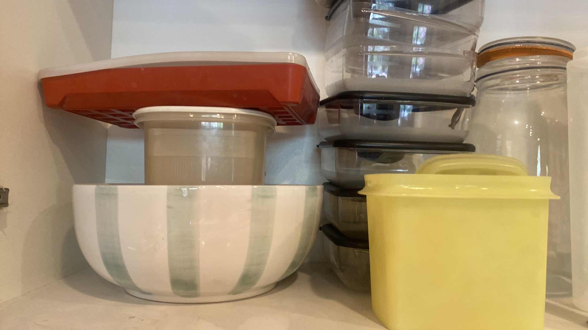 Photo 1 of CONTENTS OF KITCHEN CABINET - PLASTIC PITCHERS & STORAGE