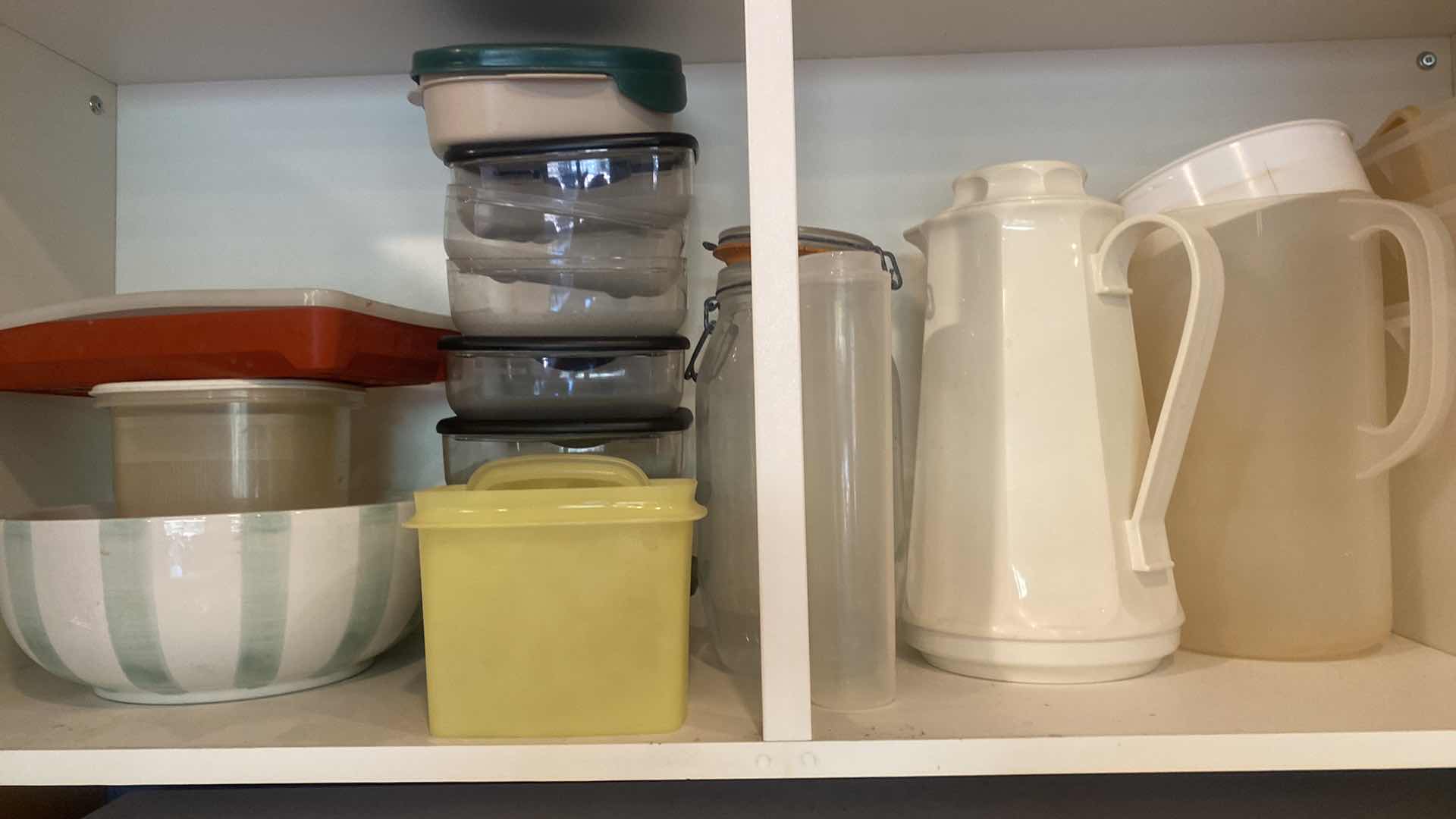 Photo 1 of CONTENTS OF KITCHEN CABINET - PLASTIC PITCHERS & STORAGE