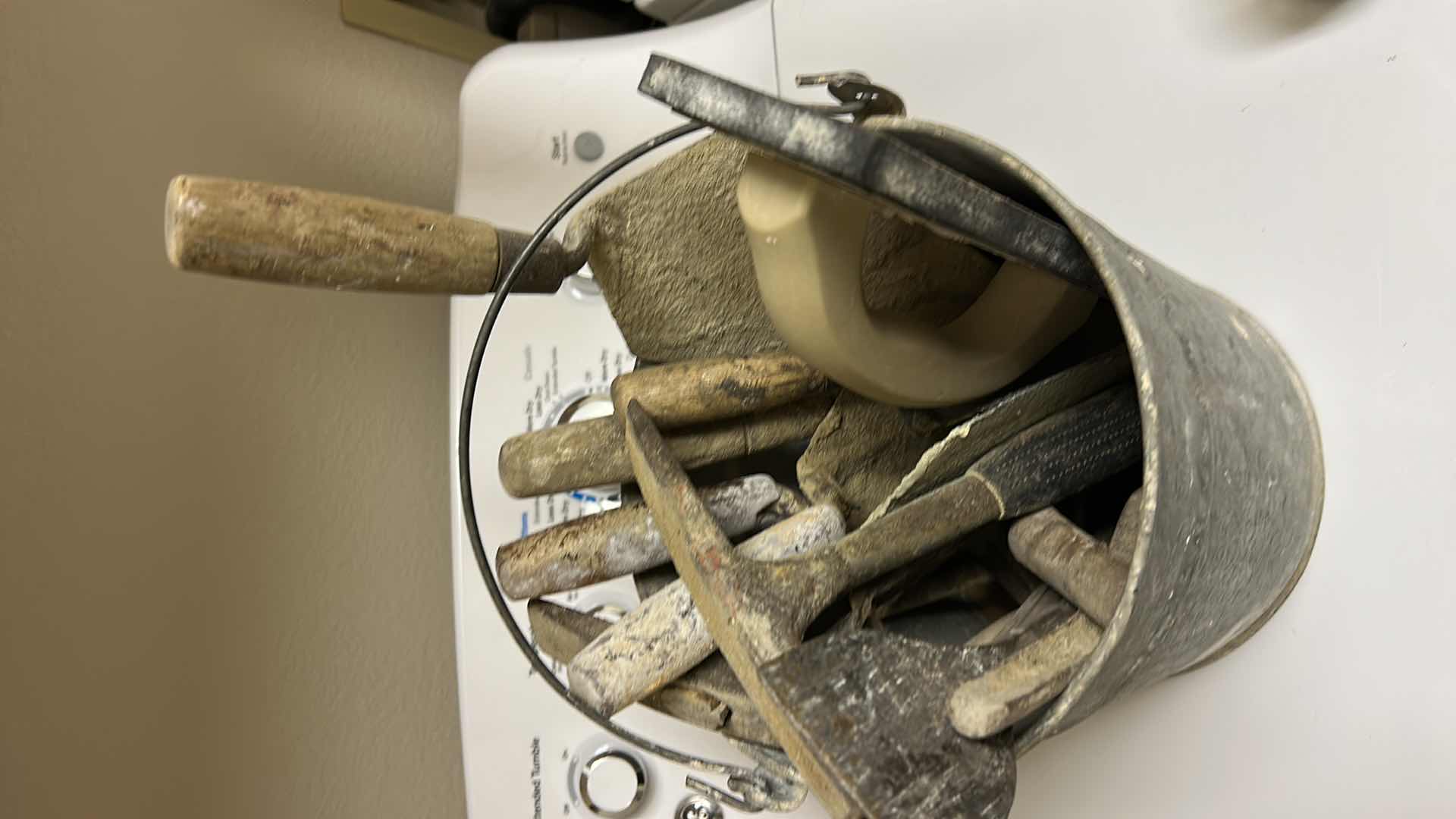 Photo 1 of METAL BUCKET FULL OF TROWELS