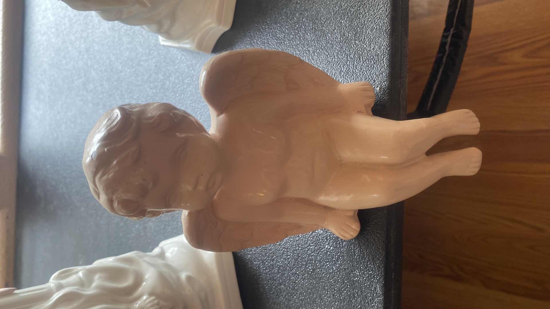 Photo 1 of 3 - CHERUBS TALLEST 11” EXCLUDING FLOWERS