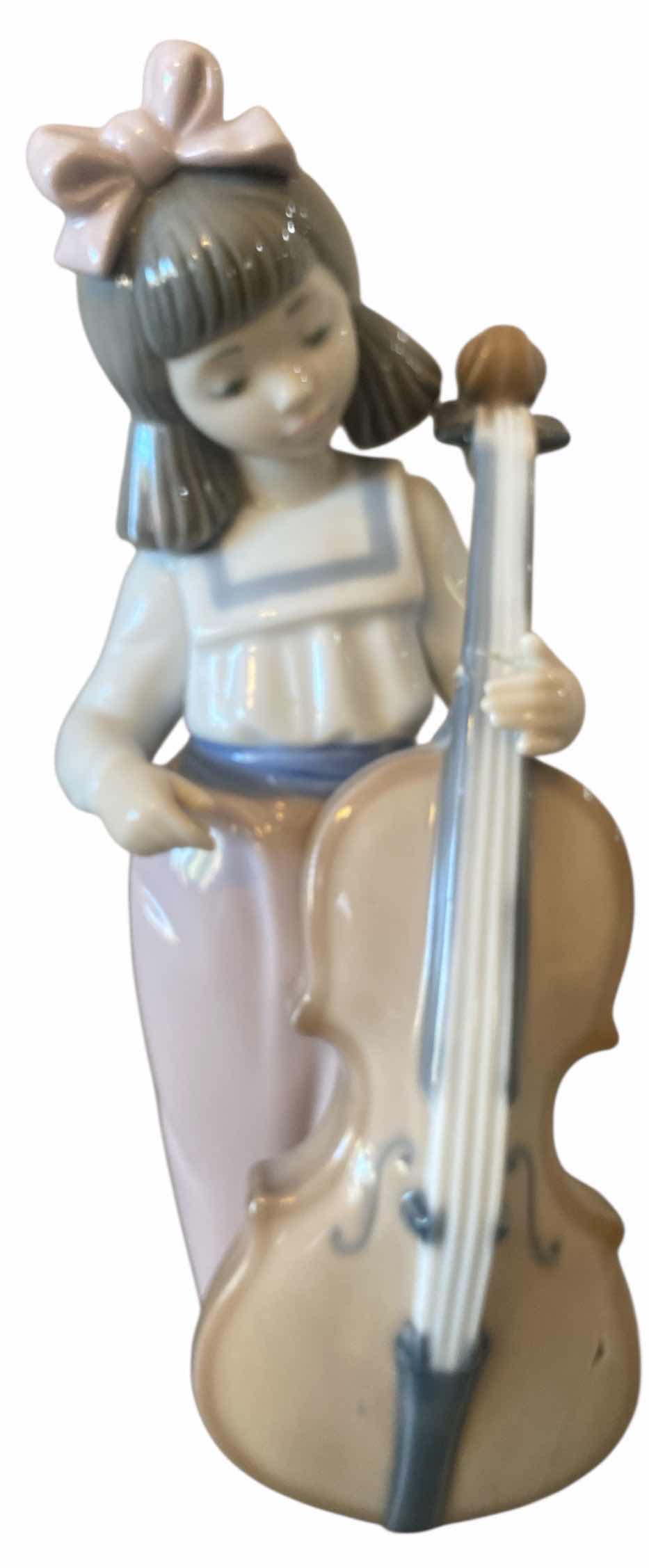 Photo 1 of NAO BY LLADRO PORCELAIN FIGURINE GIRL WITH CELLO H7 1/2”