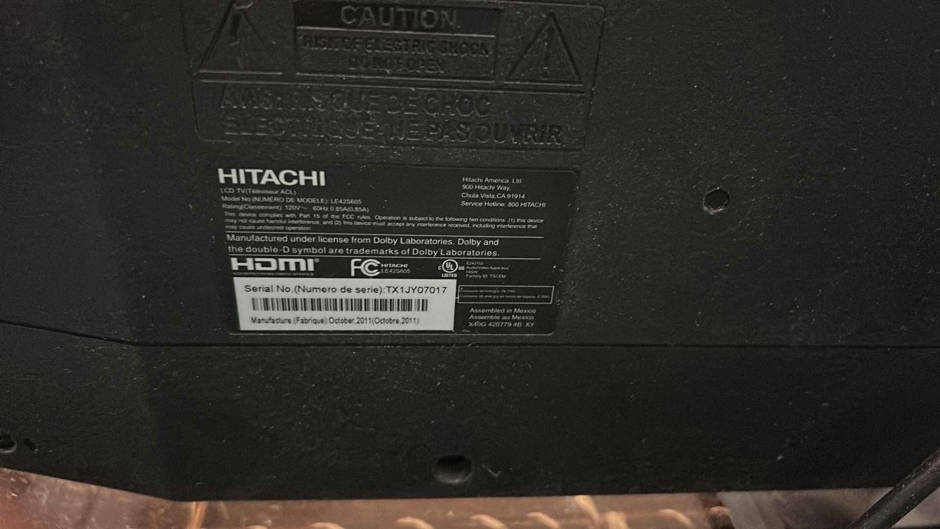 Photo 1 of HITACHI 42" FLAT SCREEN TV ON STAND W REMOTE