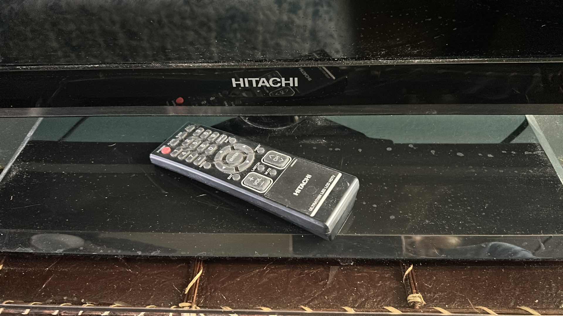 Photo 1 of HITACHI 42" FLAT SCREEN TV ON STAND W REMOTE