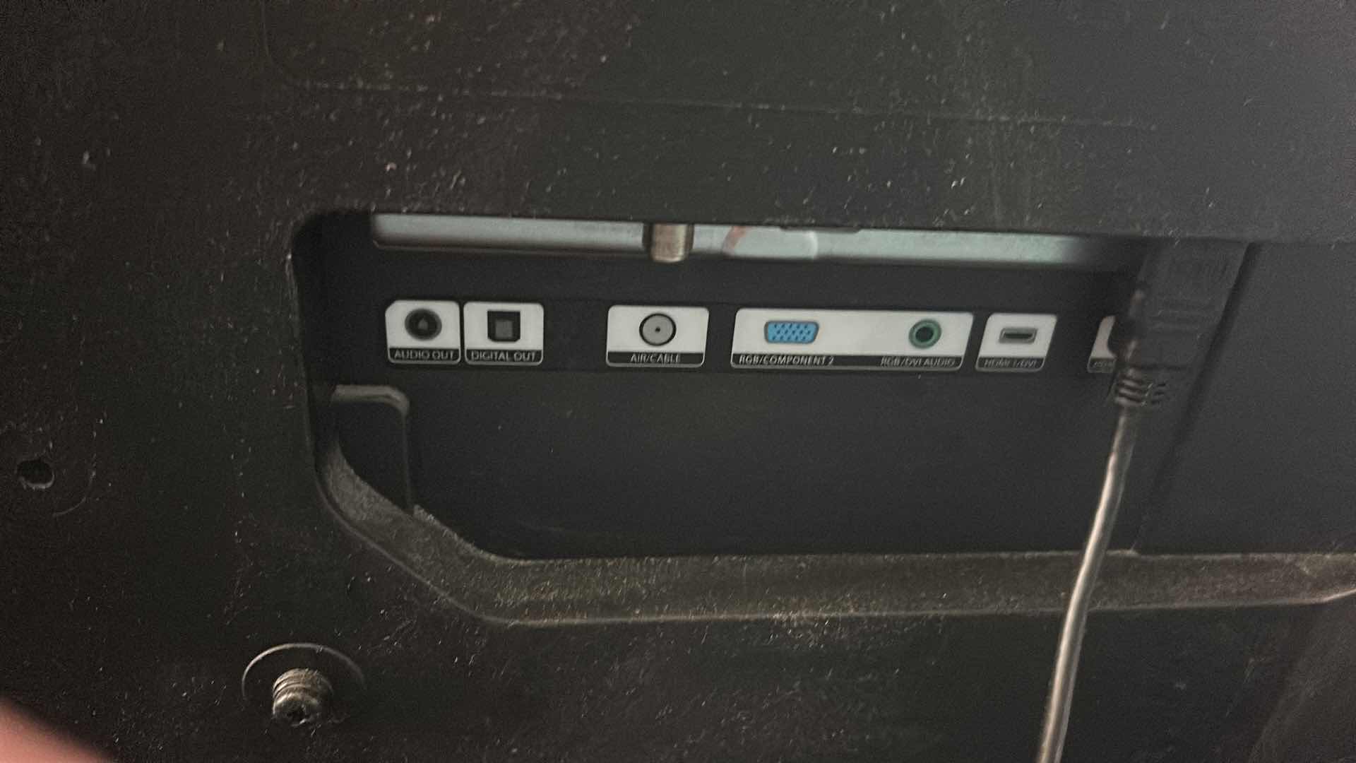 Photo 1 of HITACHI 42" FLAT SCREEN TV ON STAND W REMOTE