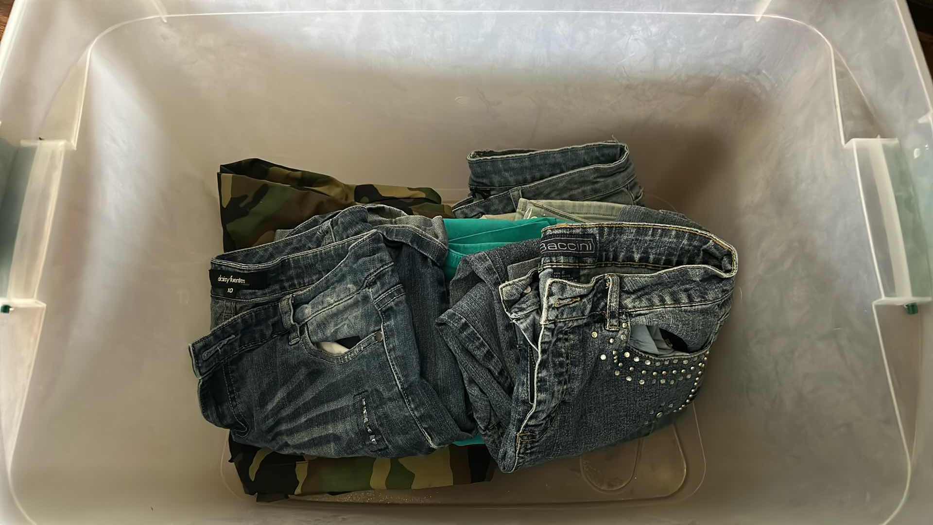 Photo 1 of CONTENTS OF PLASTIC CONTAINER ASSORTED WOMENS PANTS SIZE 6,8,10