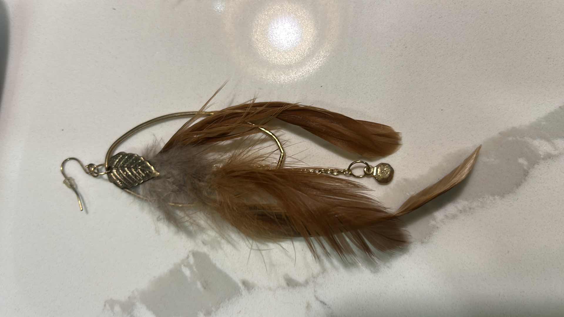Photo 1 of JEWELRY - GOLD TONE FEATHER PIERCED EARRINGS