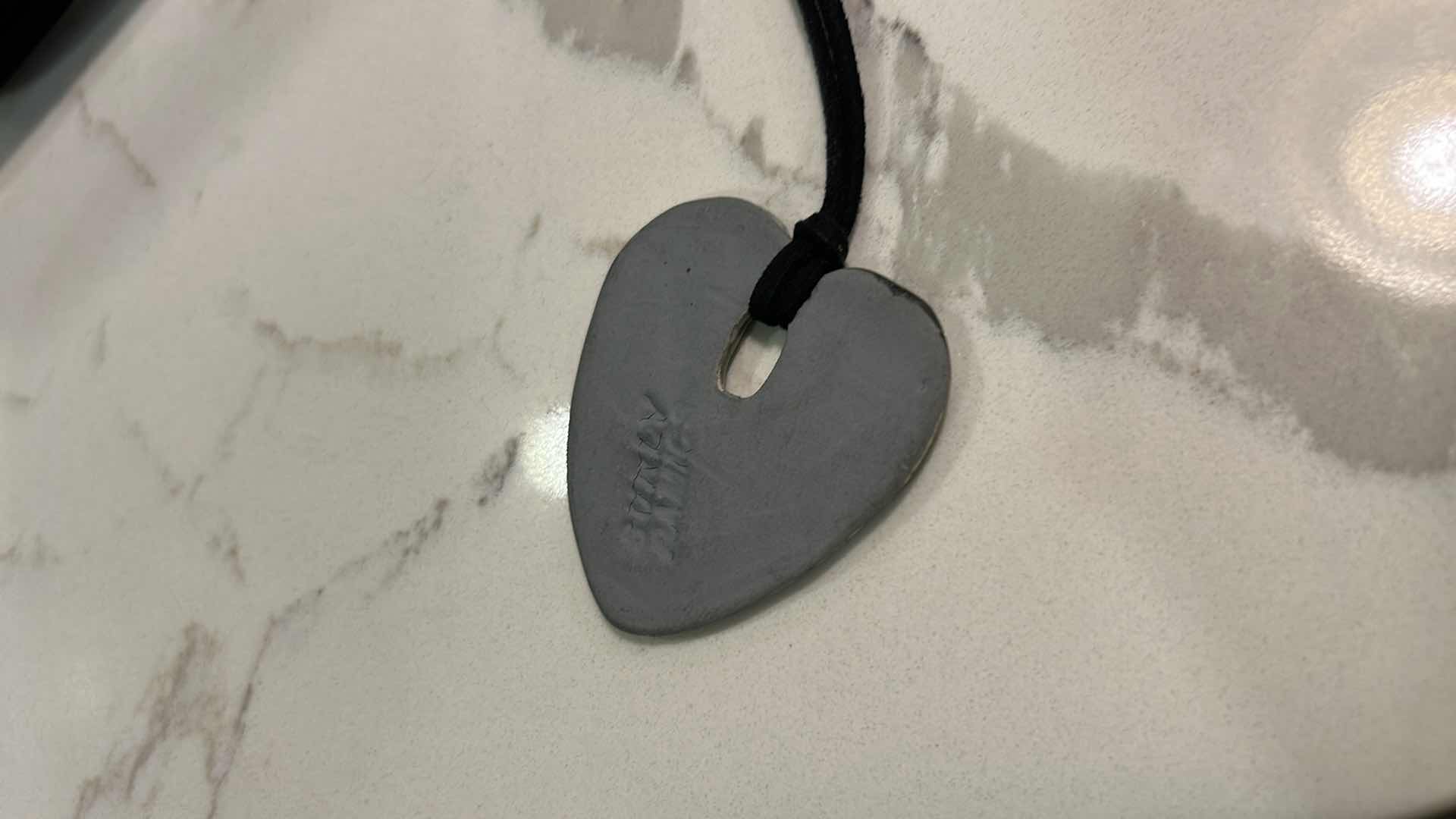 Photo 1 of MEN / WOMENS JEWELRY- FROM THE BRAND  SURLY-RAMICS,  HAND FORMED, HAND PAINTED BY ARTIST AMY DAVID ROTH,  CERAMIC HEART WITH GUITAR MADE FROM EARTHENWARE CLAY, FIRED TWICE AND FINISHED WITH LEAD FREE FOOD SAFE GLAZES. EACH PIECE IS UNIQUE