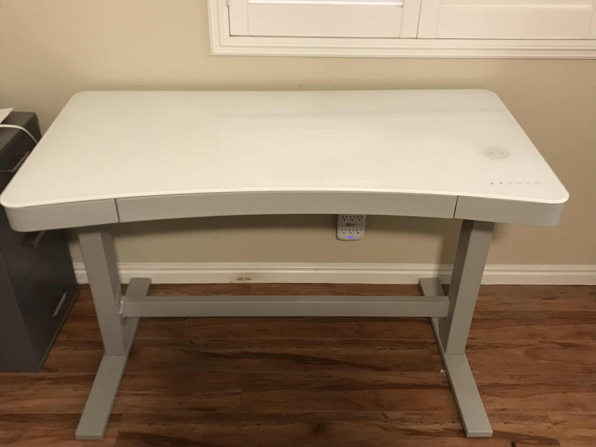 View 1 of TRESANTI POWER ADJUSTABLE CURVED COMPUTER DESK 47x23x29.5 
MORE OF THIS COLLECTION IN AUCTION