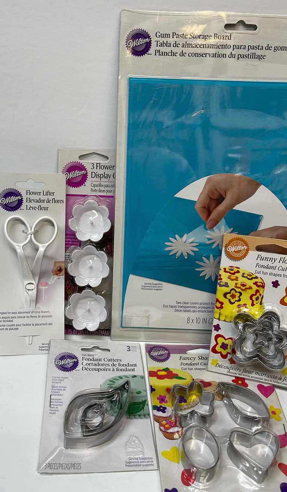 Photo 1 of NIB WILTON FONDANT CUTTERS , GUM PASTE STORAGE BOARD AND MORE- TOTAL RETAIL PRICE $45.00