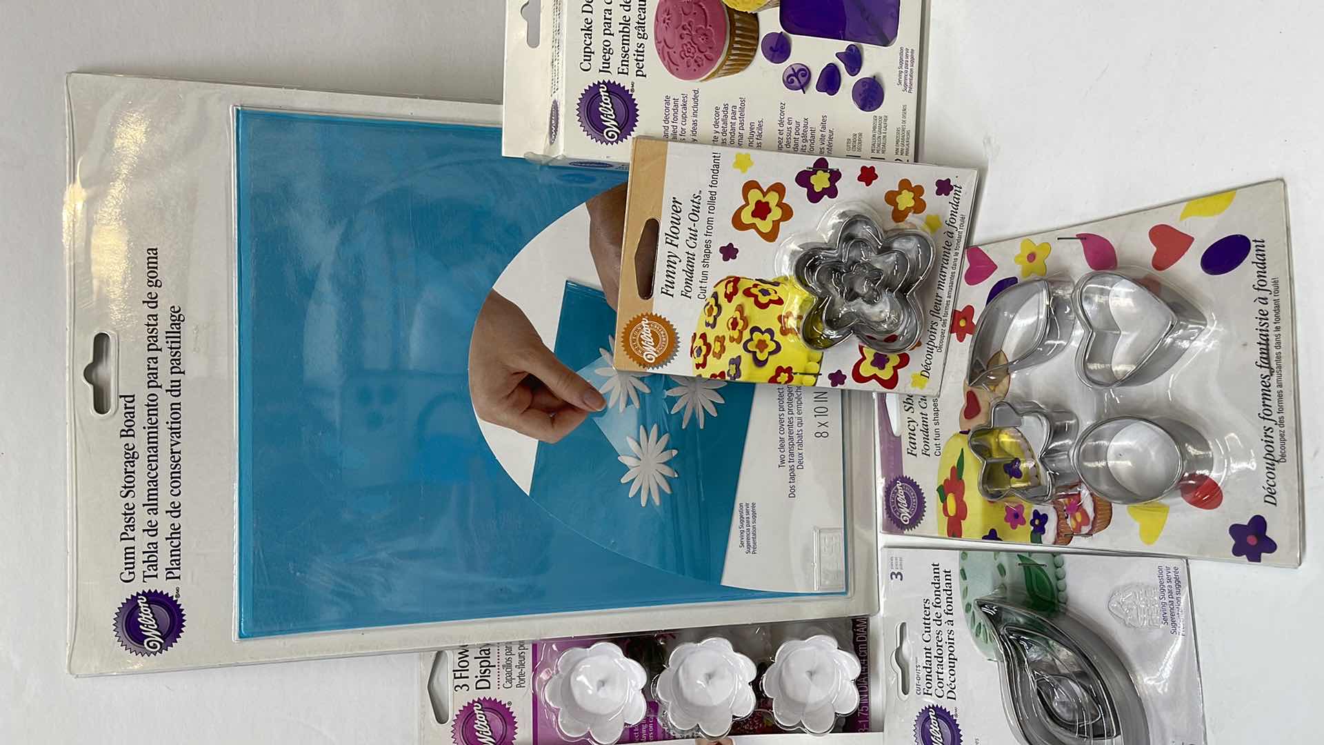 Photo 1 of NIB WILTON FONDANT CUTTERS , GUM PASTE STORAGE BOARD AND MORE