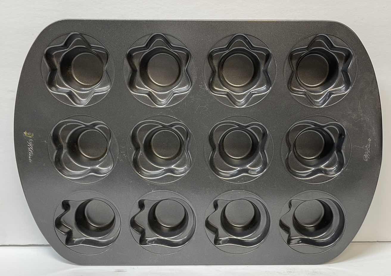 Photo 1 of NIB WILTON SPRING TIME MUFFIN PAN, COOKIE CUTTERS AND MORE- $37.00