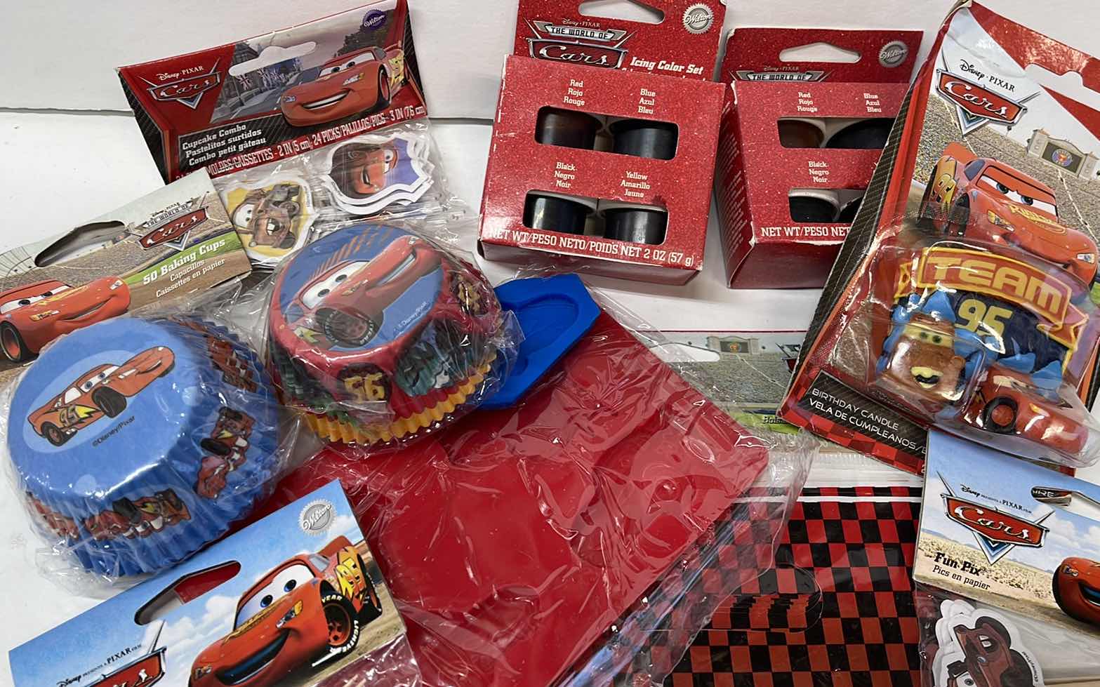Photo 1 of NEW DISNEY CARS PARTY , LIGHTING MCQUEEN CAKE PAN , CUPCAKE LINERS , GOODIE BAGS , TOPPERS AND MORE - RETAIL PRICE $61.99