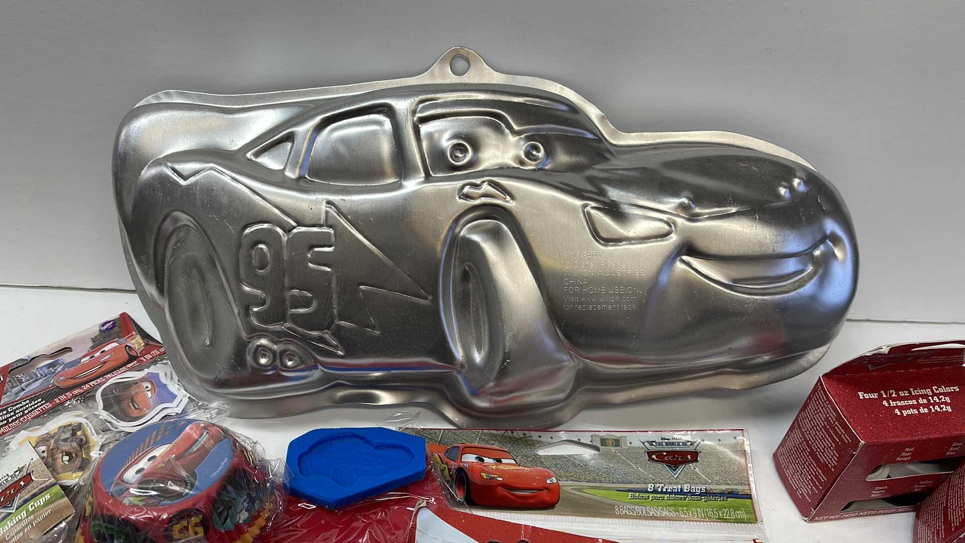 Photo 1 of NEW DISNEY CARS PARTY , LIGHTING MCQUEEN CAKE PAN , CUPCAKE LINERS , GOODIE BAGS , TOPPERS AND MORE - RETAIL PRICE $61.99
