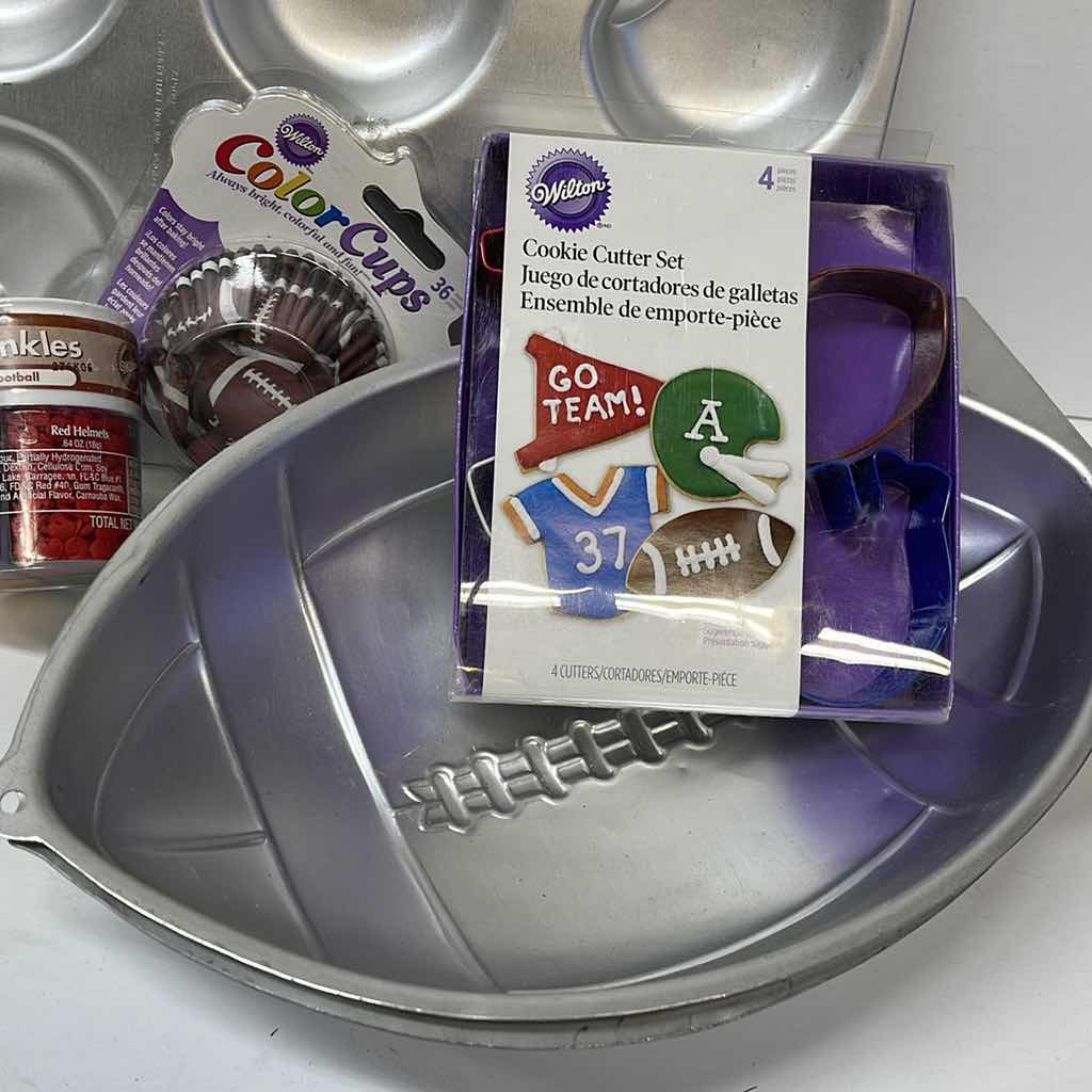 Photo 1 of NEW WILTON FOOTBALL PARTY CAKE PANS , CUPCAKE LINNERS , TOPPERS AND MORE - RETAIL PRICE $41.00