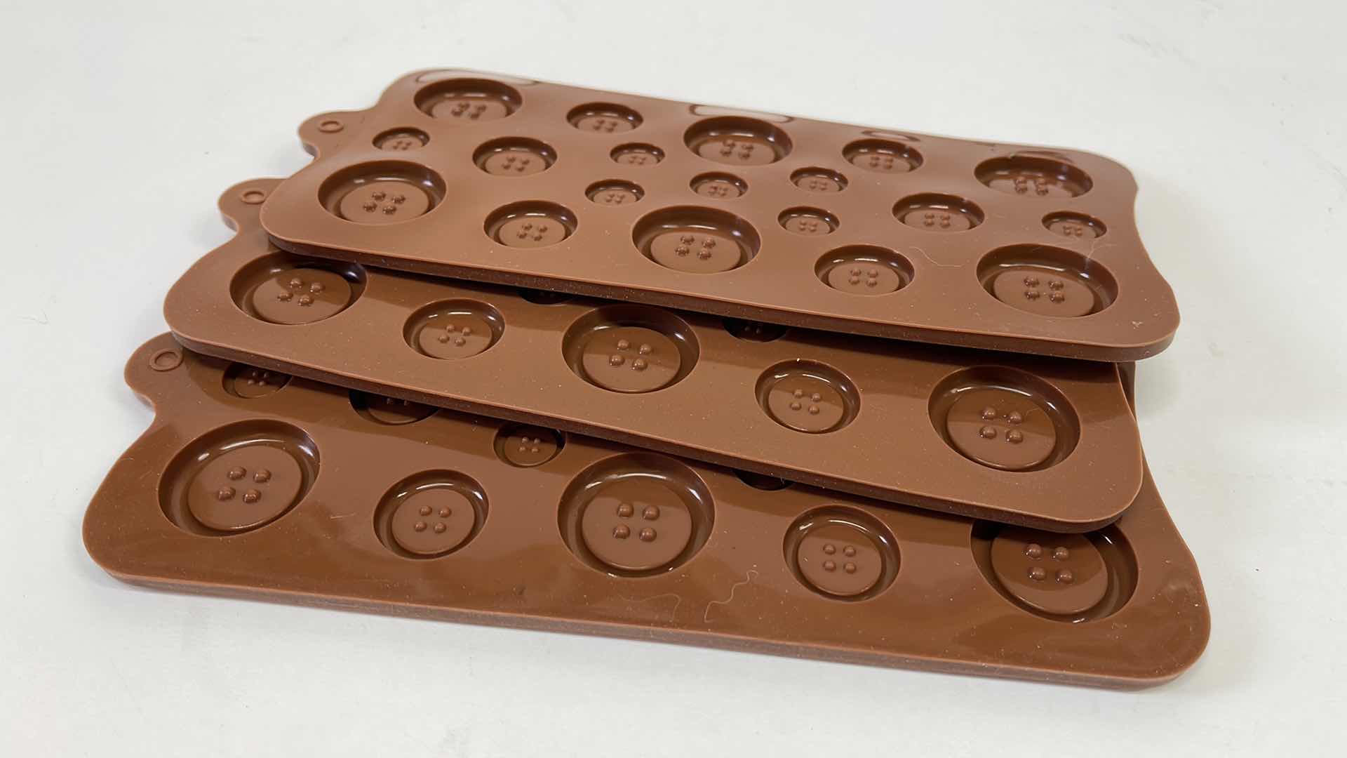 Photo 1 of NEW SILICONE BUTTON CANDY AND OTHER CRAFTS MOLDS -TOTAL RETAIL PRICE $22.00