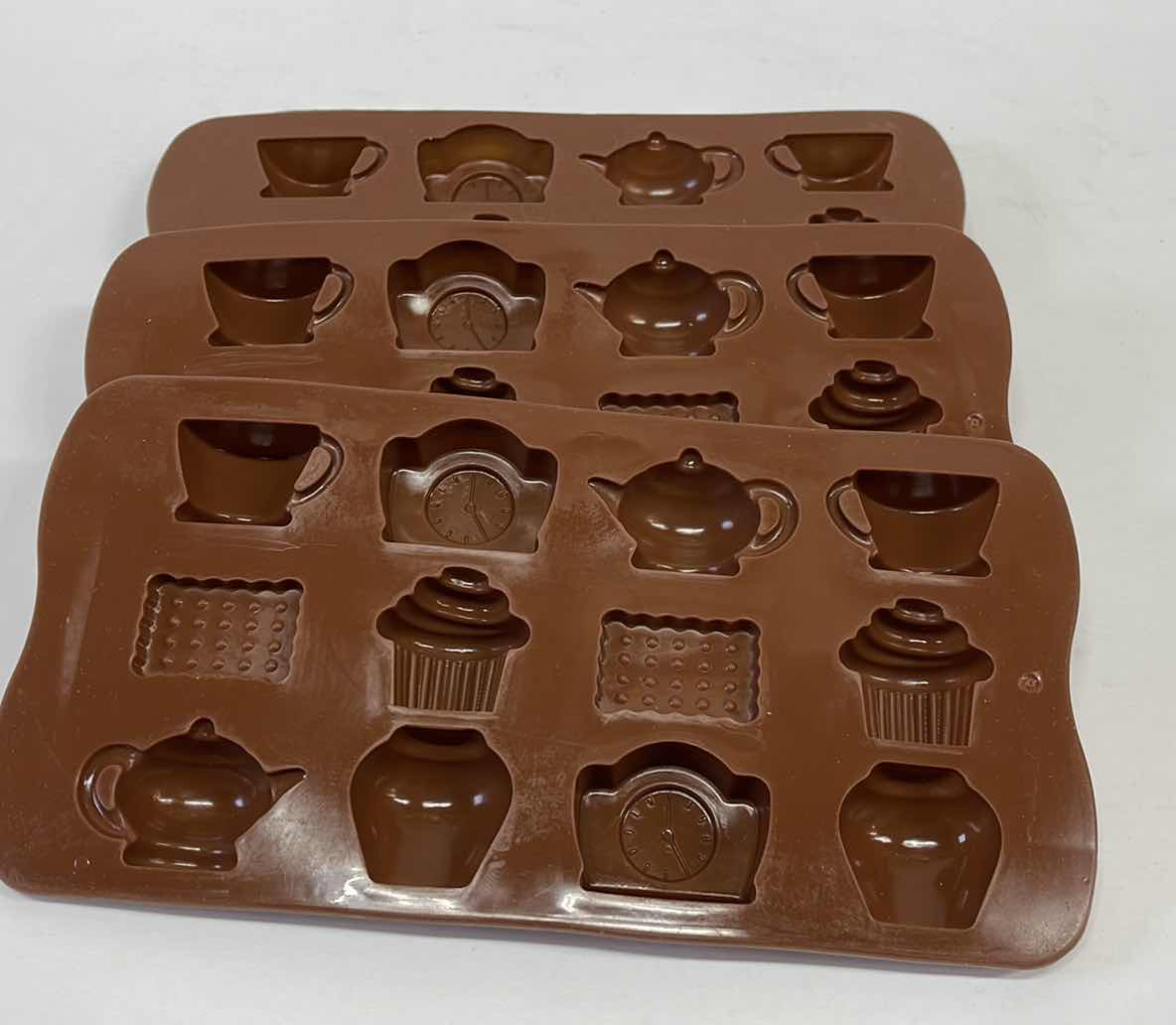 Photo 1 of NEW 3 SILICONE TEA TIME CHOCOLATE / CANDY / ICE MOLDS - TOTAL RETAIL PRICE $22.00