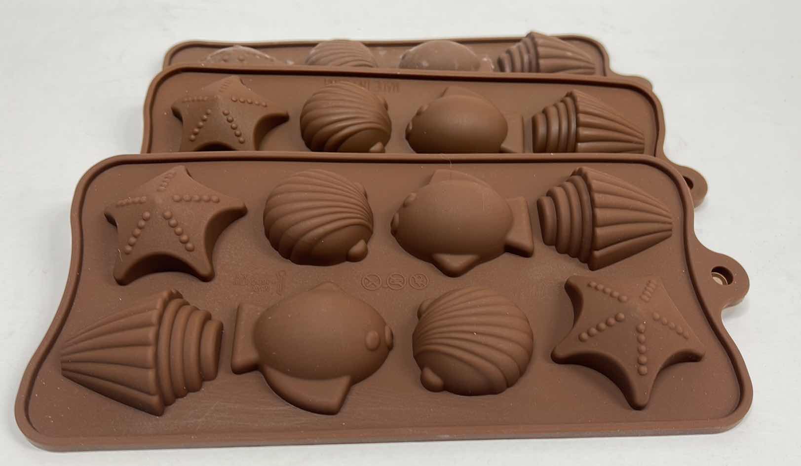 View 1 of NEW 3 SILICONE TEA OCEAN CHOCOLATE / CANDY / ICE MOLDS - TOTAL RETAIL PRICE $22.00