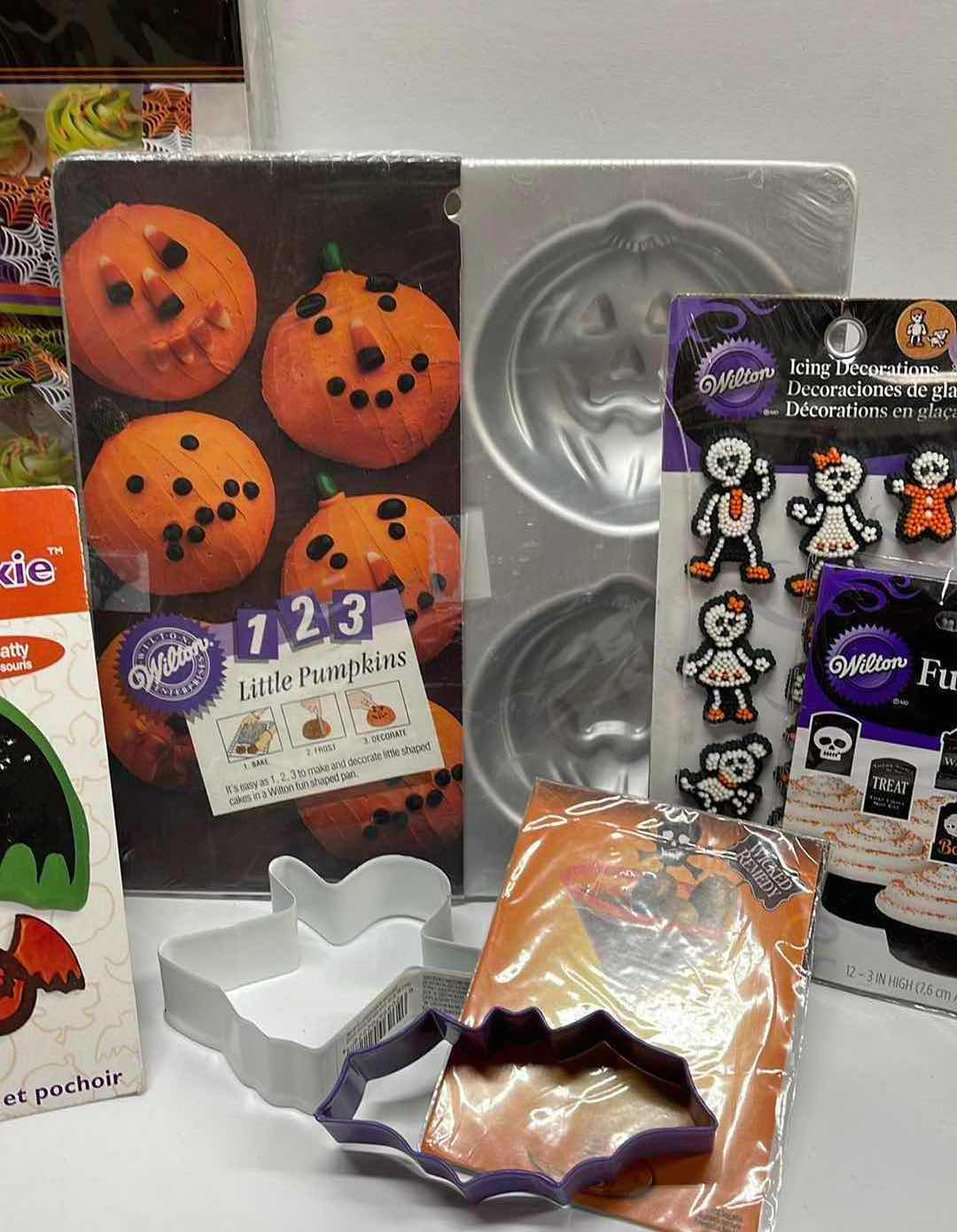 Photo 1 of NEW WILTON LITTLE PUMPKINS TRAYS , TREAT BOXES , CUPCAKE HOLDERS, COOKIE CUTTERS AND MORE - TOTAL RETAIL PRICE $45.00