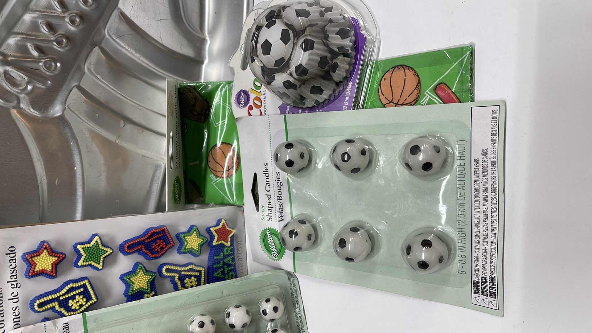 Photo 1 of NOS WILTON SPORTS CAKE PAN , SOCCER CUPCAKE LINERS , CANDLES & MORE - TOTAL RETAIL PRICE $34.00