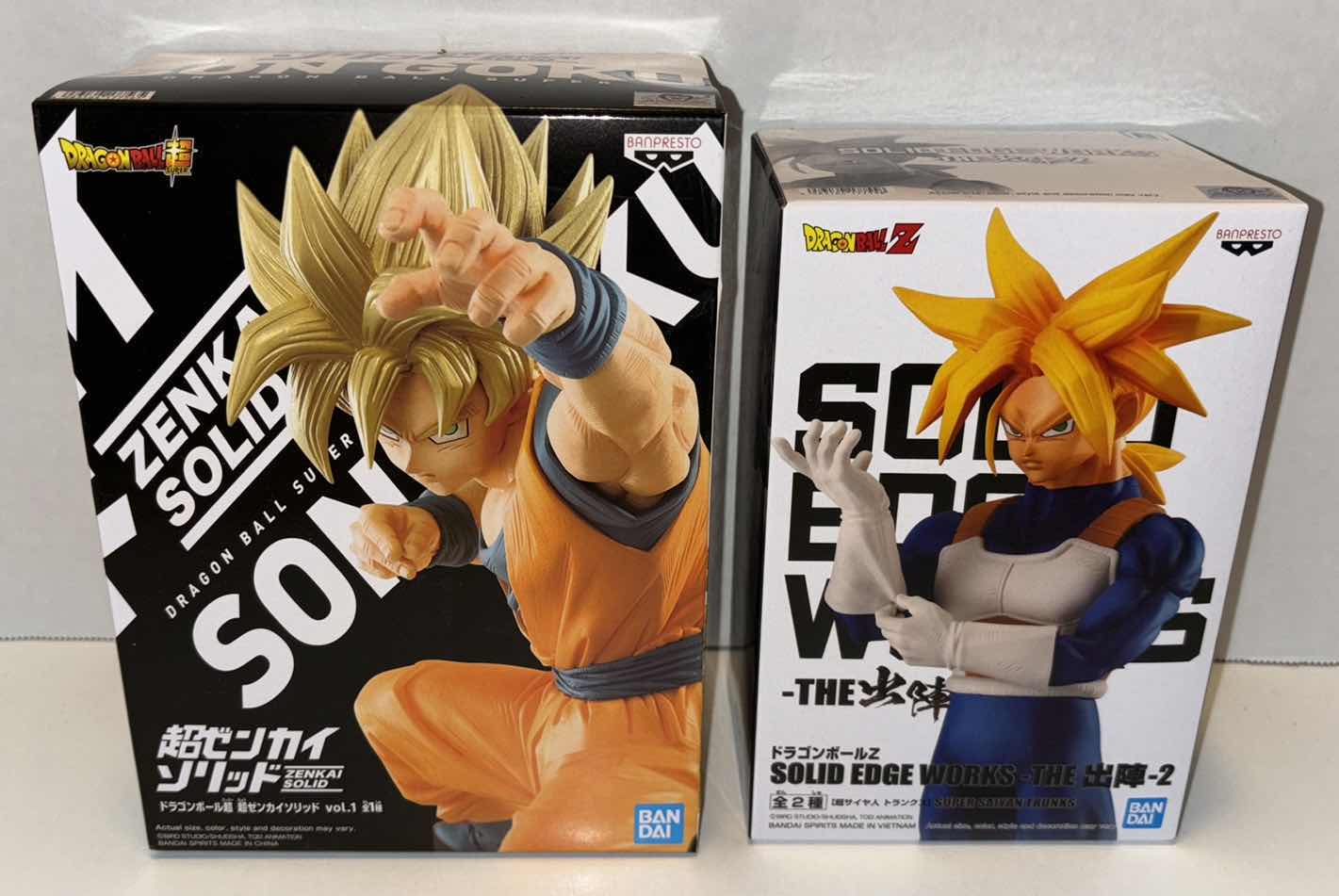 Photo 1 of NEW BANPRESTO BANDAI DRAGONBALL Z STATUE 2-PACK, 
SUPER ZENKAI SOLID VOL 1 SUPER SAIYAN GOKU & SOLID EDGE WORKS VOL 2 SUPER SAIYAN TRUNKS