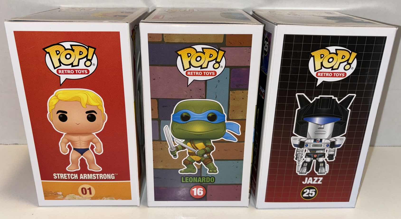 Photo 1 of NEW FUNKO POP! RETRO TOYS VINYL FIGURE 3-PACK, #01 STRETCH ARMSTRONG, TMNT #16 LEONARDO & TRANSFORMERS #25 JAZZ