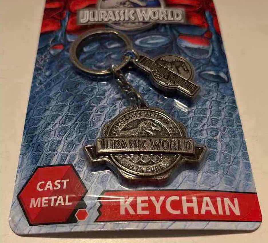 Photo 2 of NEW 2-PACK FACTORY ENTERTAINMENT JURASSIC WORLD CAST METAL KEYCHAIN