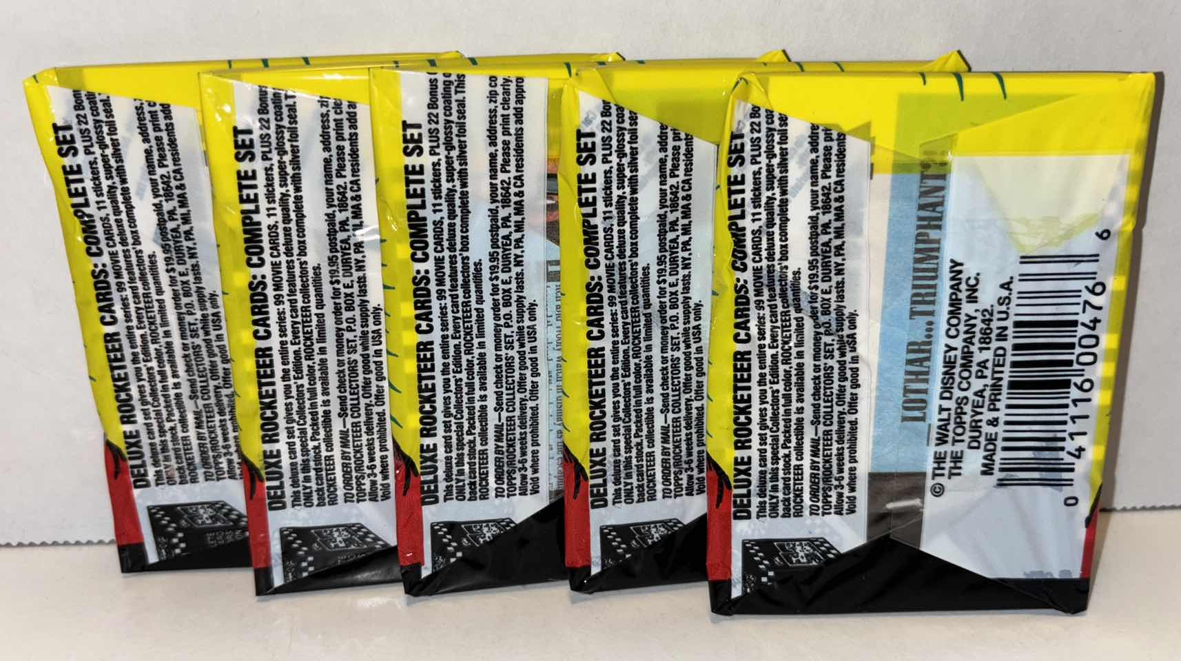 Photo 1 of NEW 5-PACK VINTAGE TOPPS 1991 COLLECTIBLE TRADING CARDS, 8 CT GLOSSY MOVIE CARDS W STICKER, “DELUXE THE ROCKETEER”