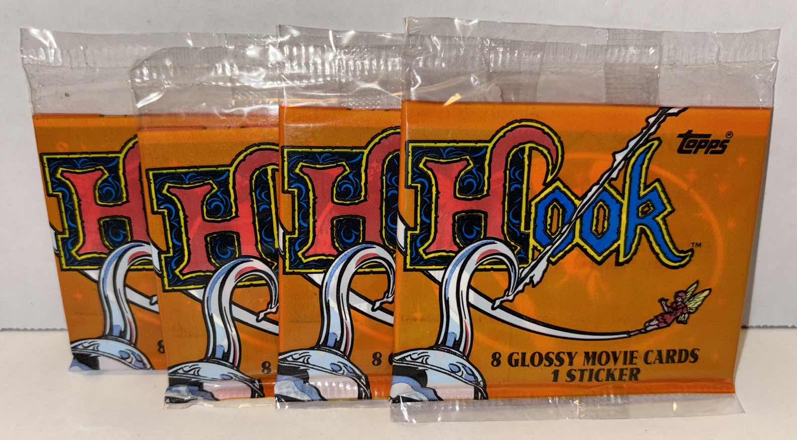Photo 1 of NEW 4-PACK VINTAGE TOPPS 1991 COLLECTIBLE TRADING CARDS, 8 CT PACKS GLOSSY MOVIE CARDS W STICKER, “HOOK”