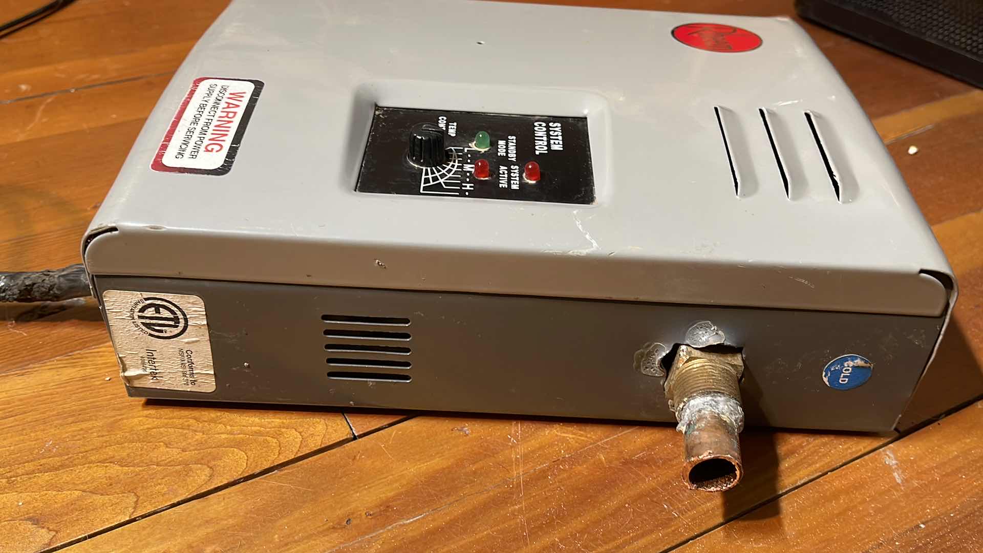 Photo 1 of RHEEM MANUFACTURING CO. ELECTRIC TANKLESS WATER HEATER MODEL RTE-13