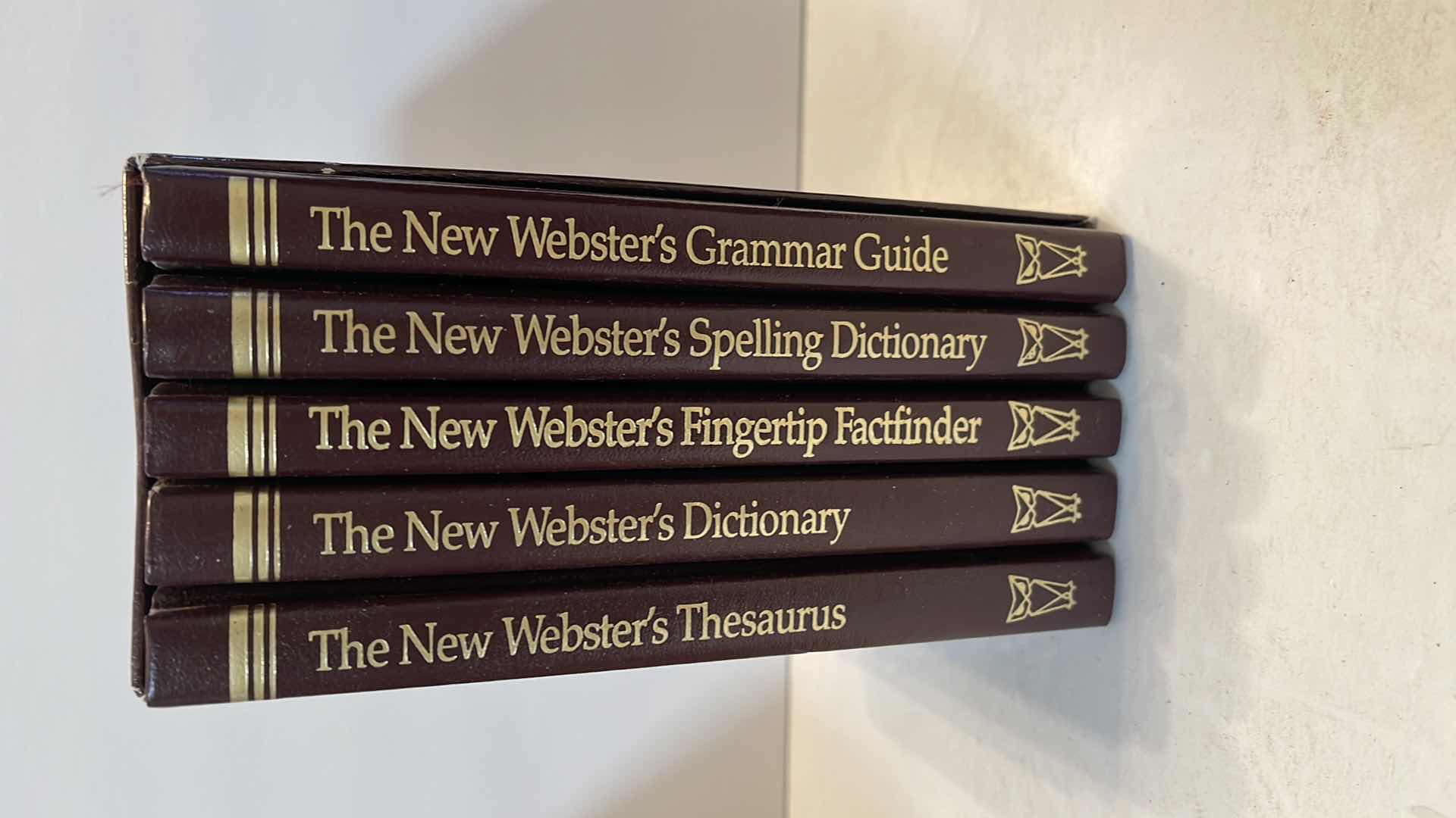 Photo 1 of VINTAGE COLLECTION OF WEBSTER DICTIONARY BOOKS